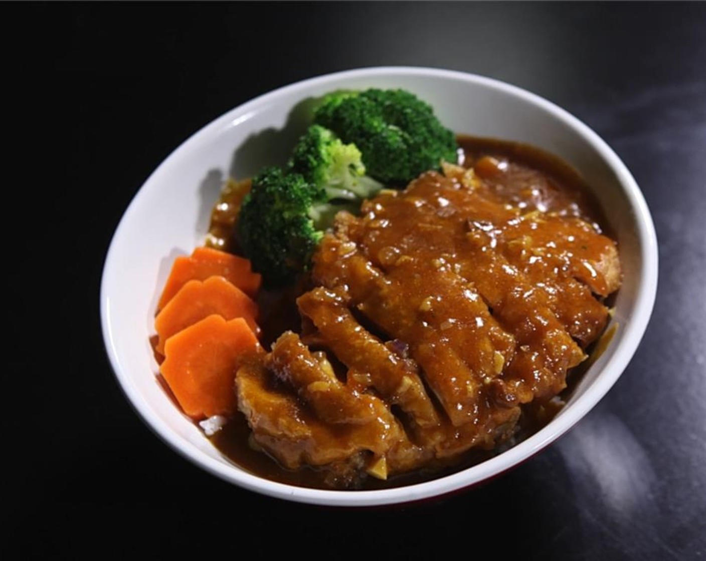 step 9 Serve your Malaysian Fried Chicken in a bowl with White Rice (to taste), Broccoli Florets (to taste), Carrots (to taste), and plenty of sauce. Enjoy!