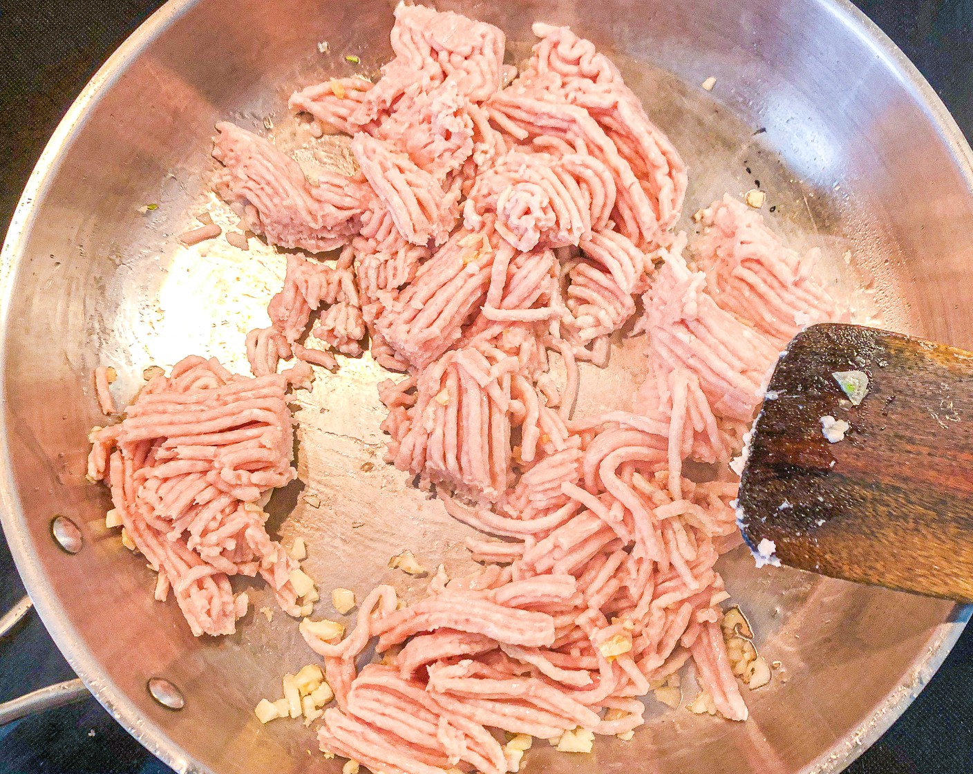 step 5 Add the Ground Chicken (455 g) and season with Salt (to taste) and Ground Black Pepper (to taste). Break into smaller pieces and cook, stirring occasionally until no longer pink, about 5 minutes.