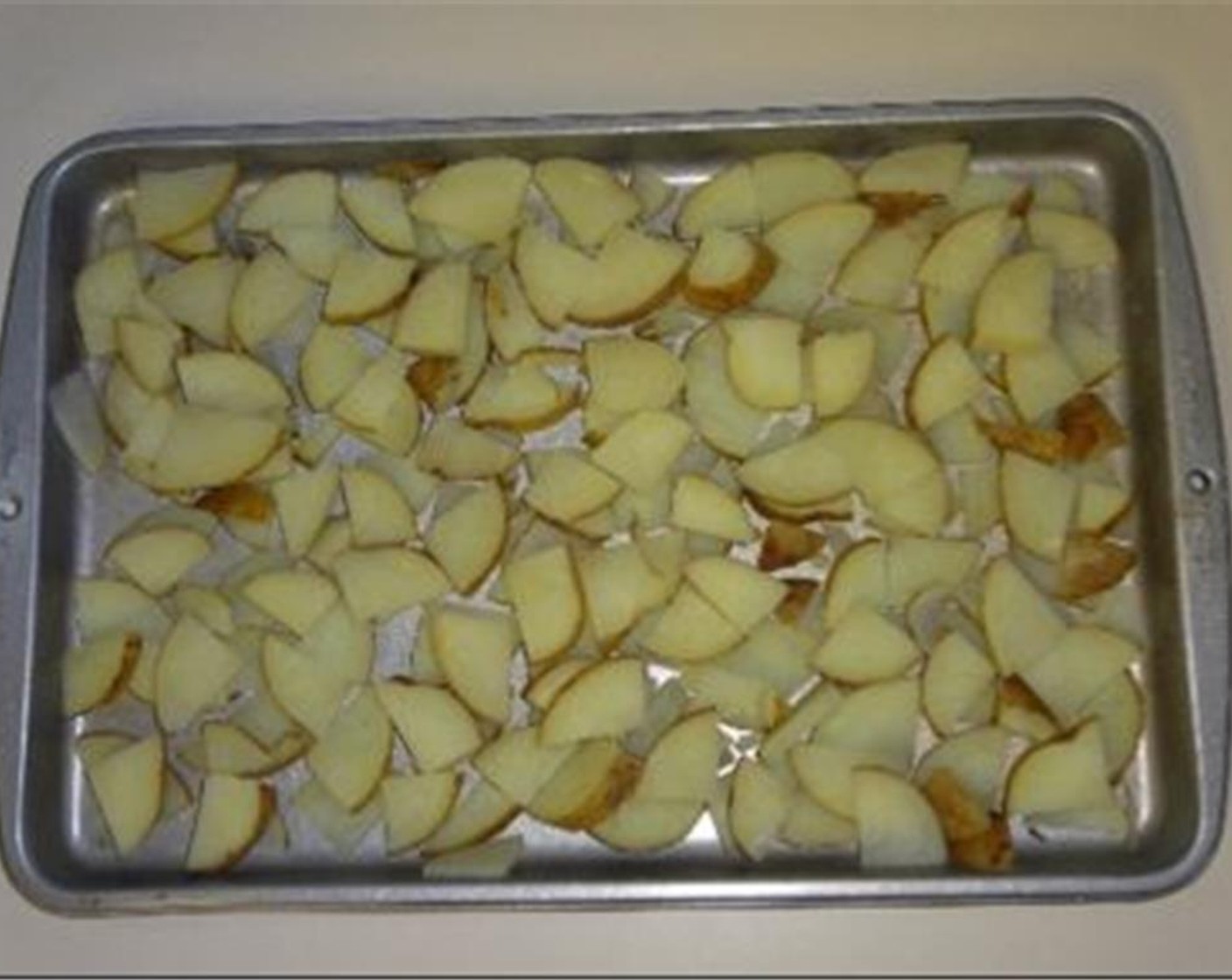 step 5 Drain potatoes and place them on a cooking sheet nor layer thick. Place in 350 degrees F (180 degrees C) oven for 10 minutes to dry out. This allows you to add more flavor and prevent the final product from becoming too wet.