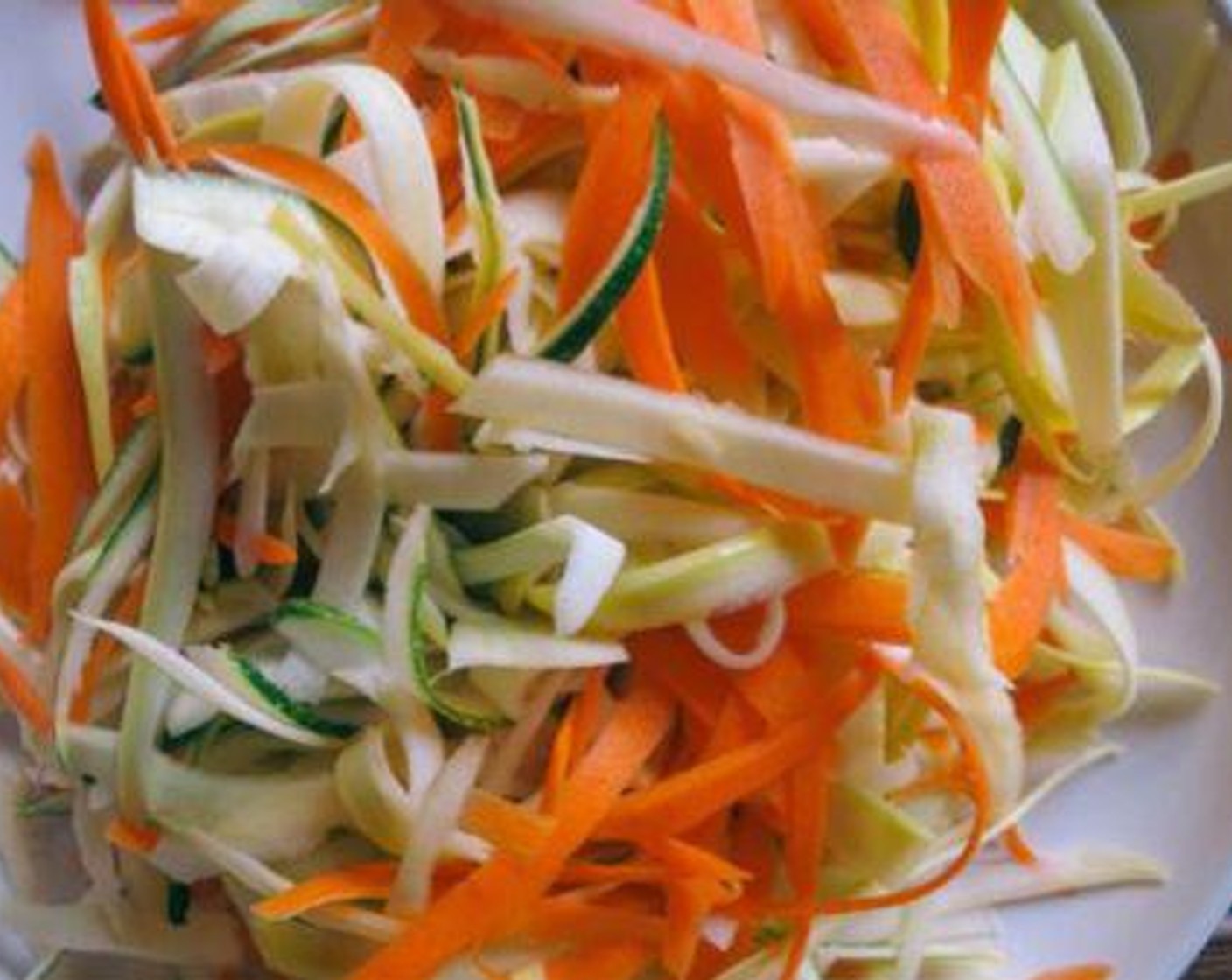 step 1 Use vegetable peeler to peel or shave Zucchini (1), Summer Squash (1) and Carrots (2) into a pasta consistency.