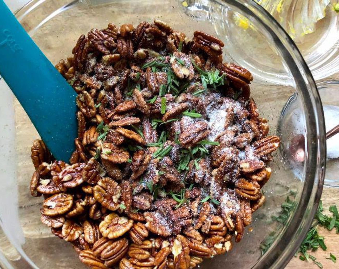 step 4 Pour mixture over the pecan halves and stir to fully incorporate. Add Fresh Rosemary (2 Tbsp) and Kosher Salt (1/2 Tbsp) and toss again to coat the nuts evenly. Turn onto the prepared sheet pan.