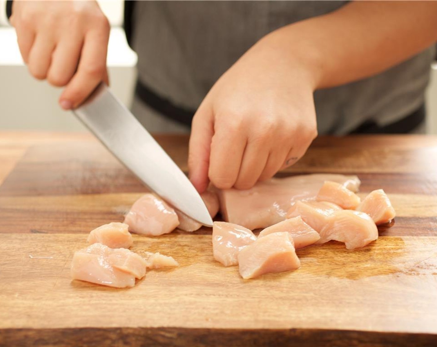 step 4 Pat dry Chicken Breasts (2) with paper towels. Cut the chicken into half inch diced pieces and place in a medium bowl.