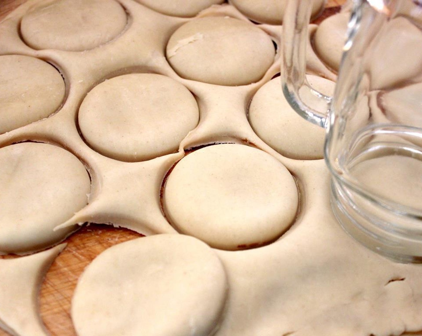 step 3 Put the other prepared pie crust on top and cut 3-inch cookies using a cookie cutter or a glass.