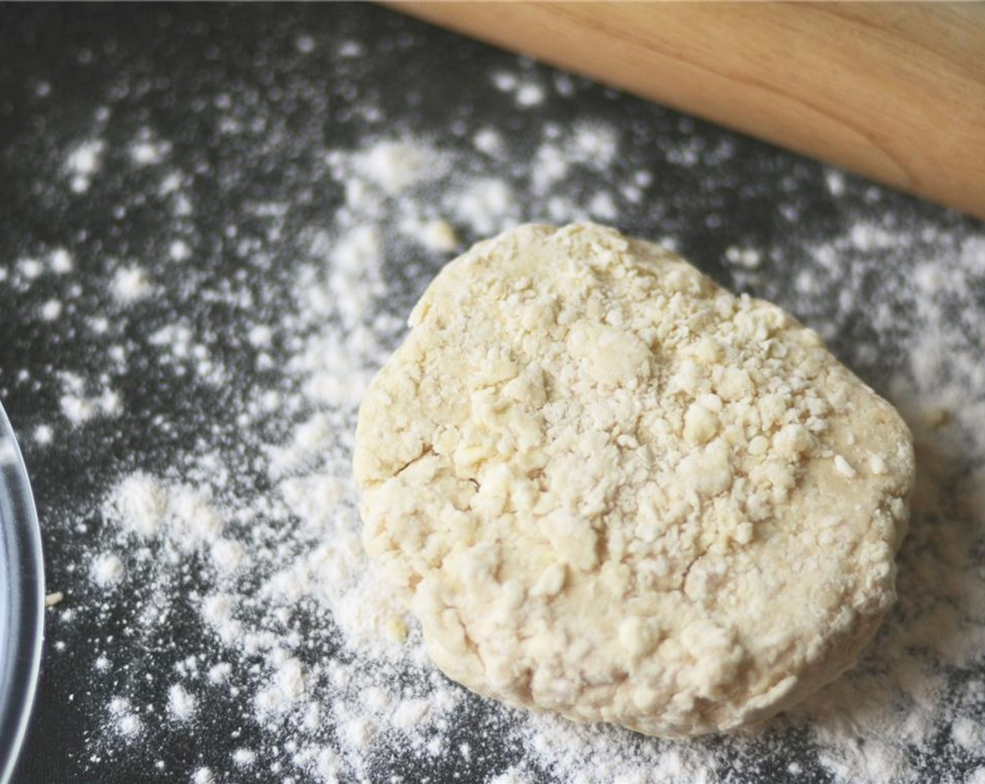 step 5 A dough ball will begin to form, but the dough will be rather shaggy - if it remains rather dry, add an additional tablespoon of buttermilk.