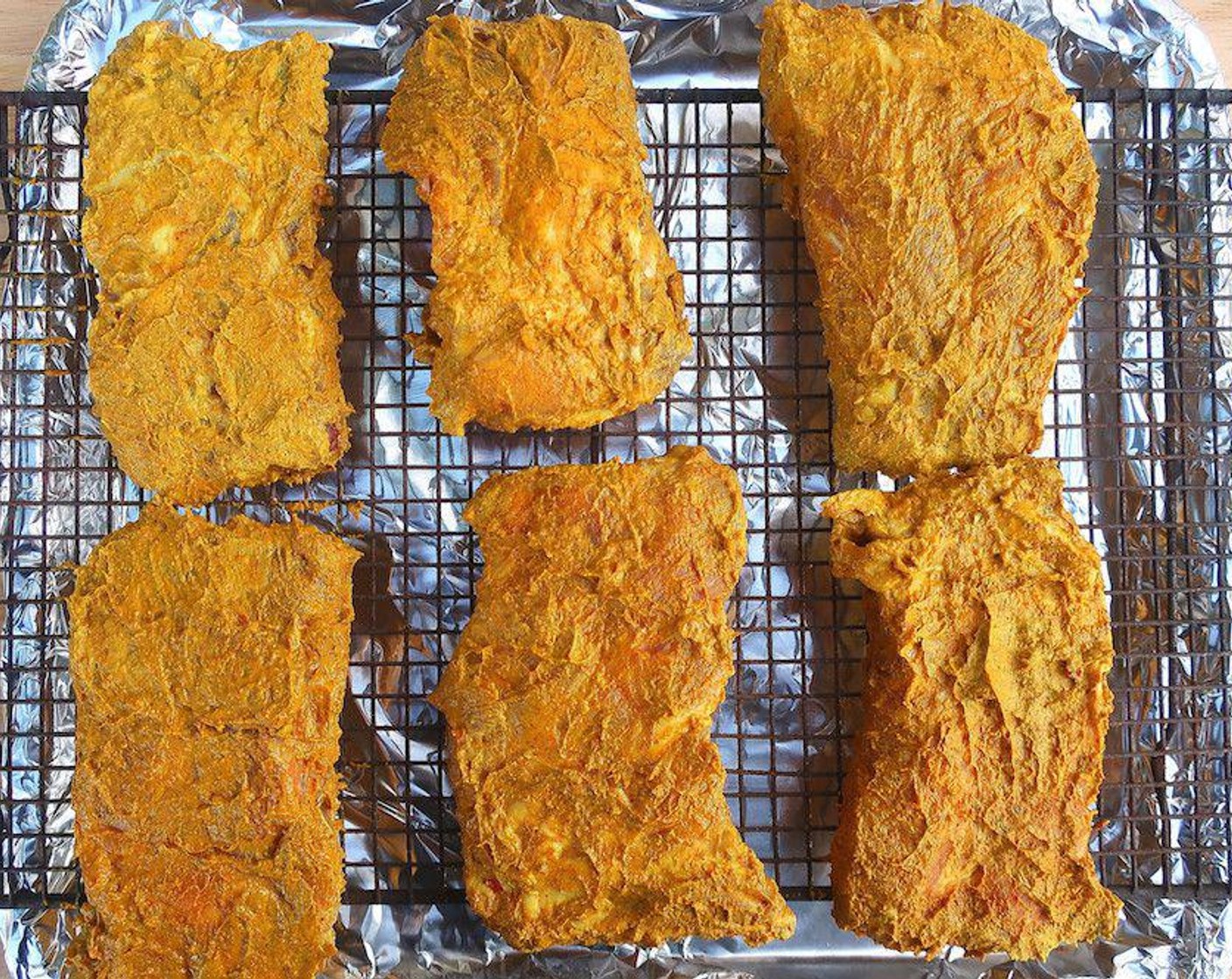 step 5 Next day, put the ribs on a rack over a baking sheet.