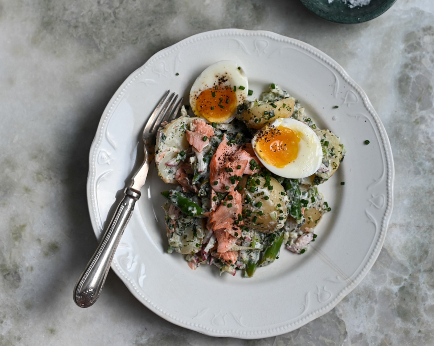 step 11 Scatter a few extra chopped chives over the top of each serving and top with two halves of the soft-boiled eggs. Add a final scatter of Maldon salt over the eggs and serve the trout salad. Enjoy!