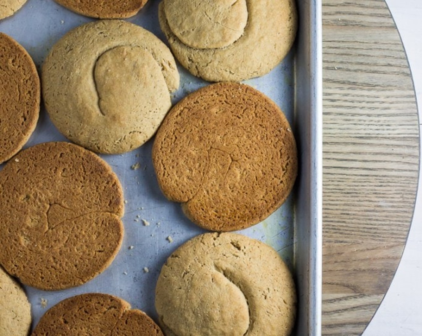 step 11 Lay halved paximadia out across baking sheets, cut side down (you will need 1 additional baking sheet). Return paximadia to oven and dry at 175 degrees F (80 degrees C) for 2 hours.