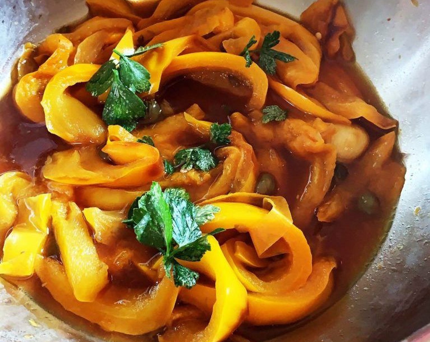 step 2 Heat up Garlic (1 clove) and Extra-Virgin Olive Oil (1 Tbsp) in a large skillet, add the sliced bell peppers, Capers (1 tsp), Salt (to taste), and Ground Black Pepper (to taste). Add 1/2 cup of water and cook on low with a lid on until cooked. Turn off the heat and add some Fresh Parsley (to taste).