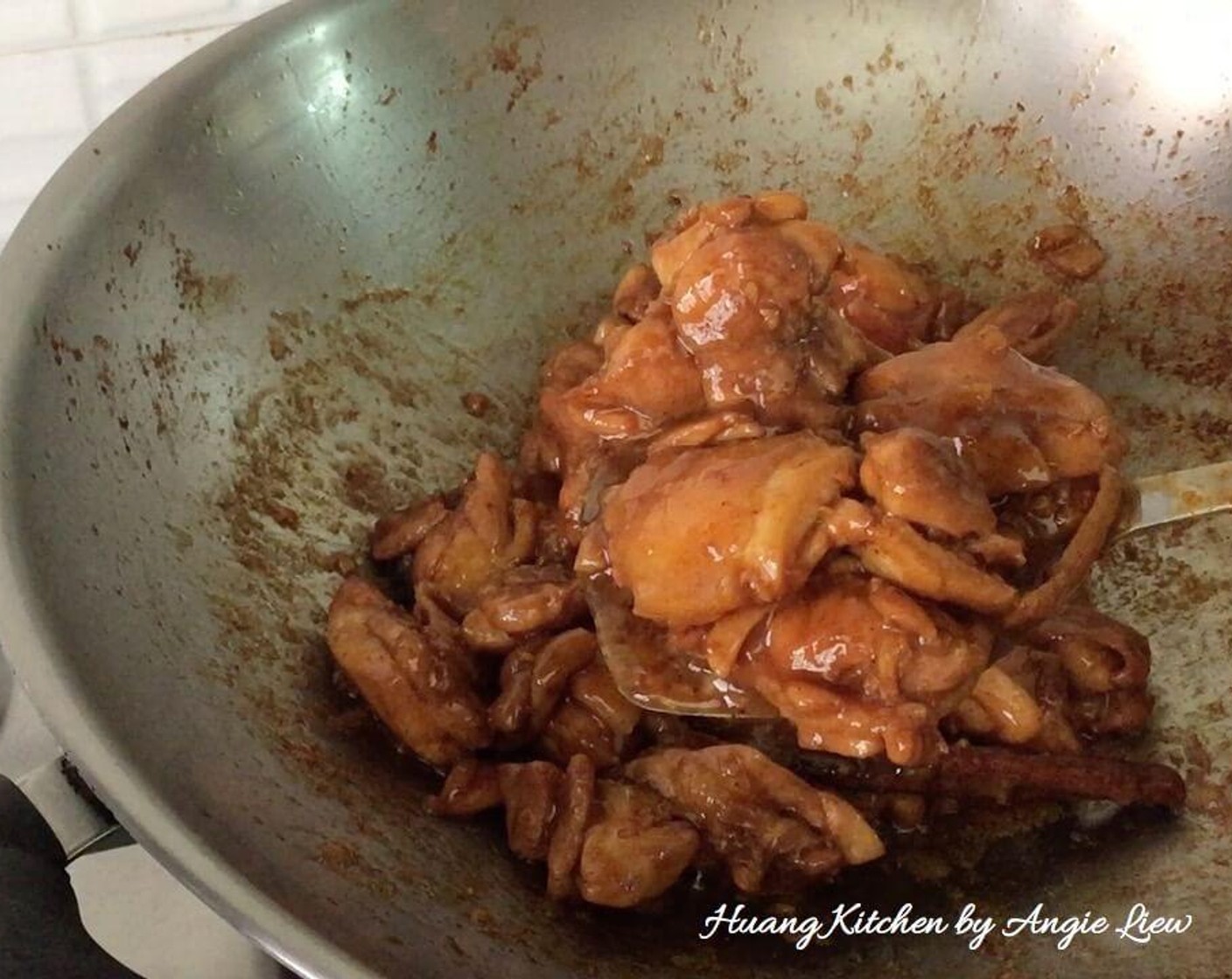 step 4 Then heat up oil in a wok and briefly fry the marinated chicken with chopped Garlic (6 cloves) until they brown lightly.
