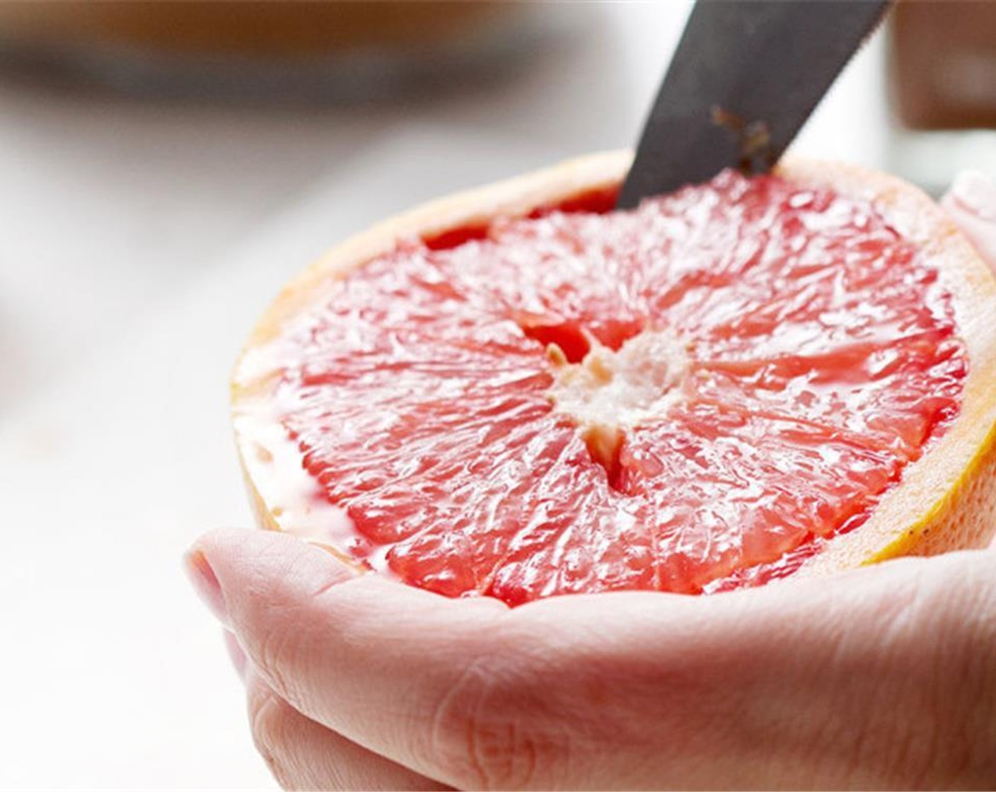 step 2 Cut around the edge of the Grapefruit (1/2) to loosen the fruit.