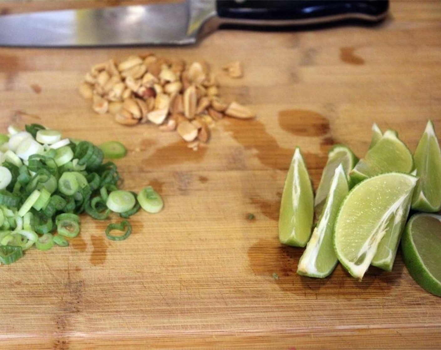 step 2 Thinly slice the Scallion (1 bunch). Cut the Lime (1) in to wedges. Chop the Peanuts (1/2 cup).