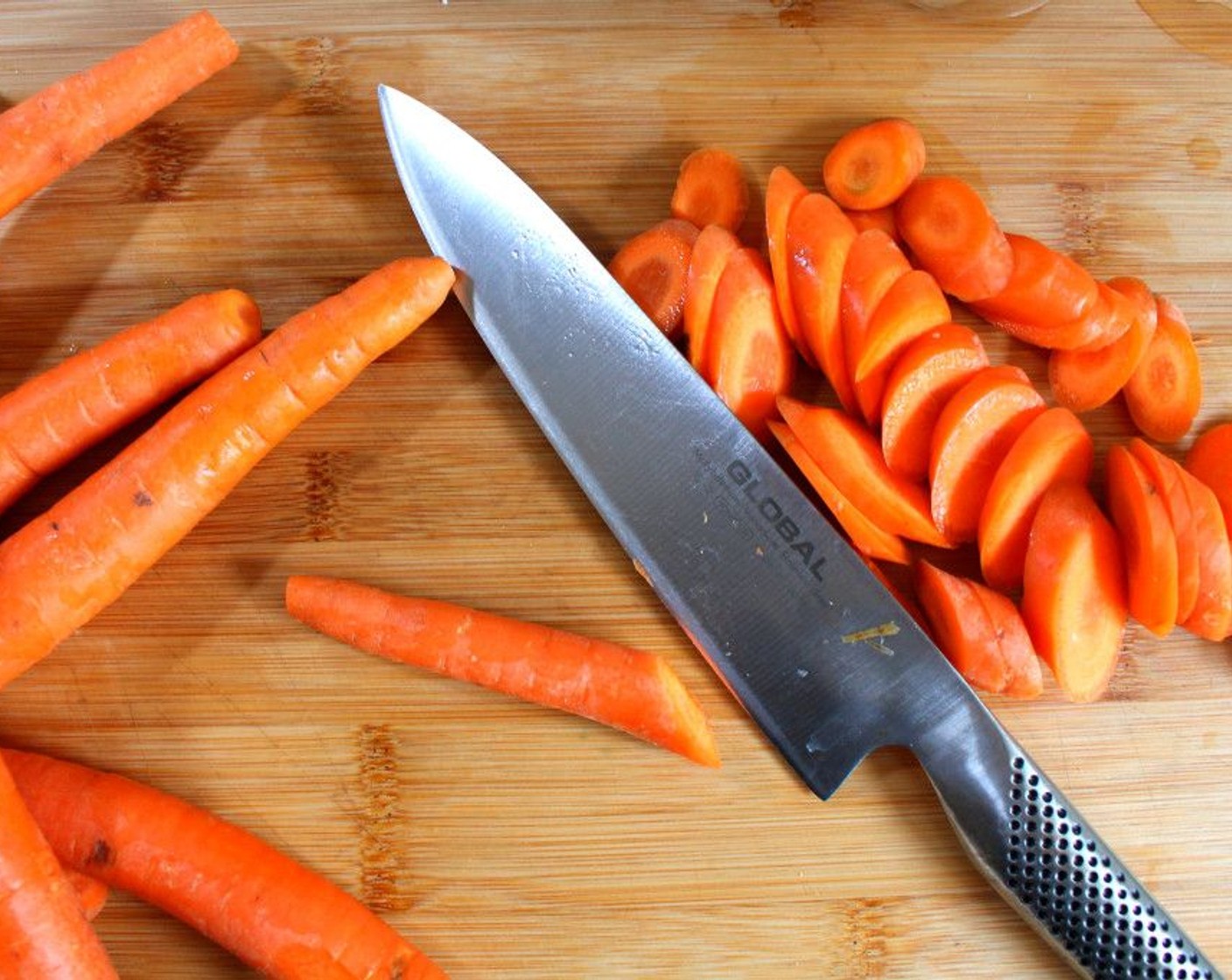 step 2 Cut Carrots (6 cups) and Onions (2) into pieces add to a soup pot.