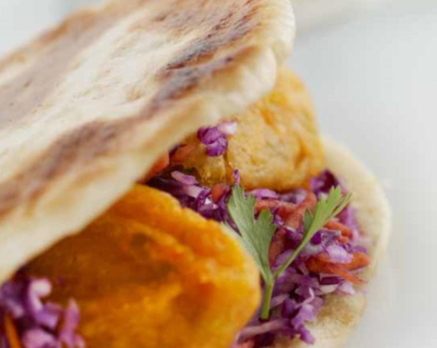 step 8 Serve the baked sweet potato falafel with the coleslaw on toasted Pita Bread (4 pieces).