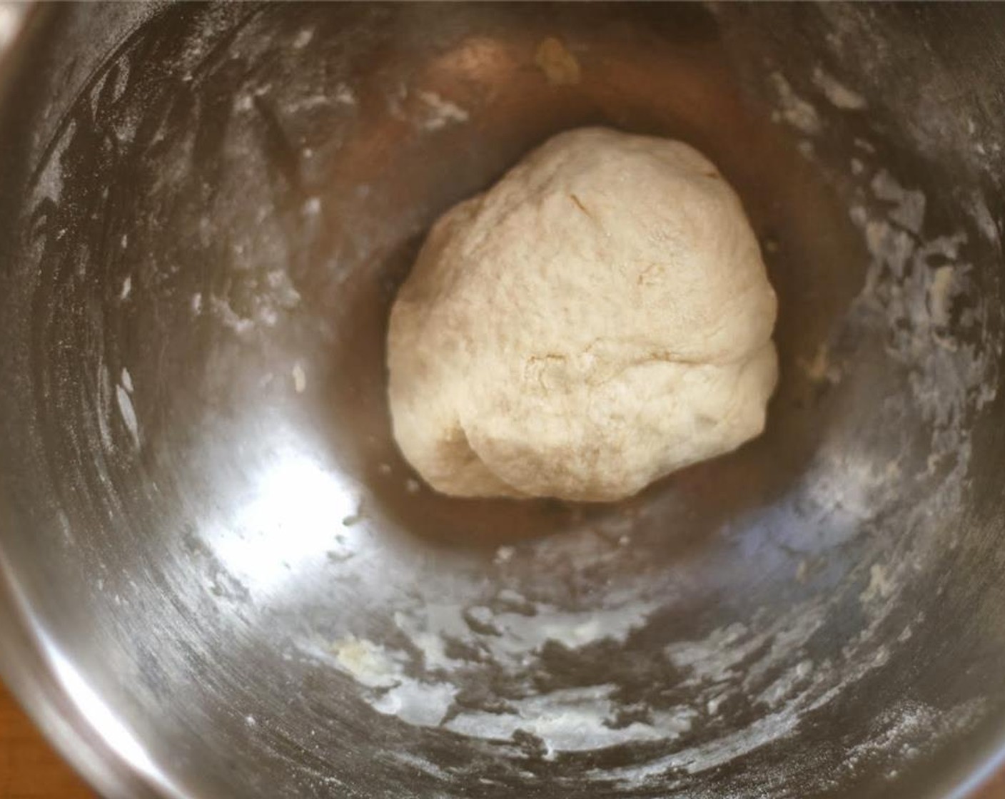 step 3 While the onions caramelize, make the dough by mixing together the All-Purpose Flour (1 cup), Vegetable Oil (1 1/2 Tbsp), Water (1/2 cup), and a Salt (1 pinch). Knead well, adding additional flour until the dough is not at all sticky.