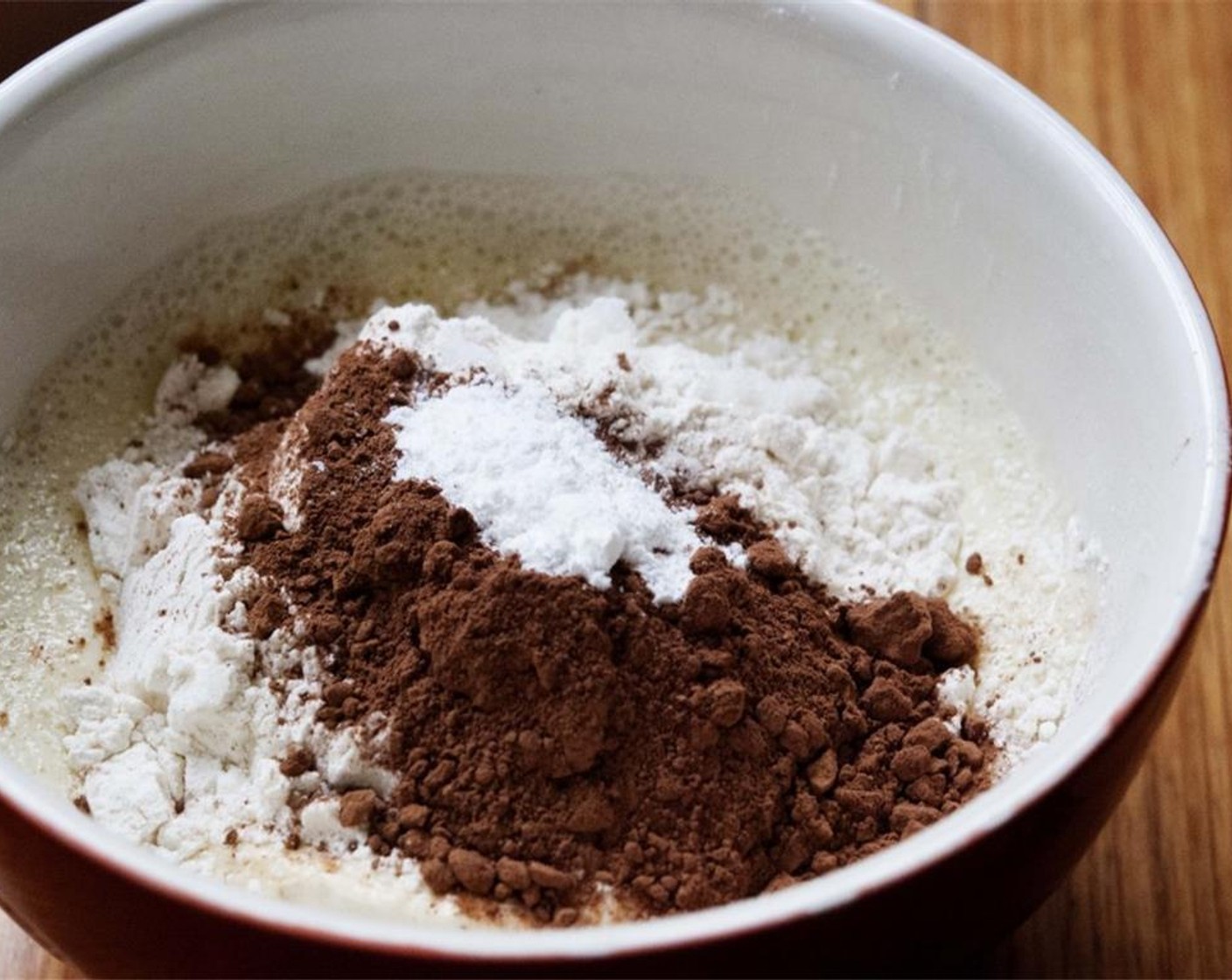 step 2 Then, add the All-Purpose Flour (1 cup) and additional All-Purpose Flour (1 Tbsp), the Baking Powder (1 tsp), Granulated Sugar (1/2 cup), and Unsweetened Cocoa Powder (2 Tbsp).