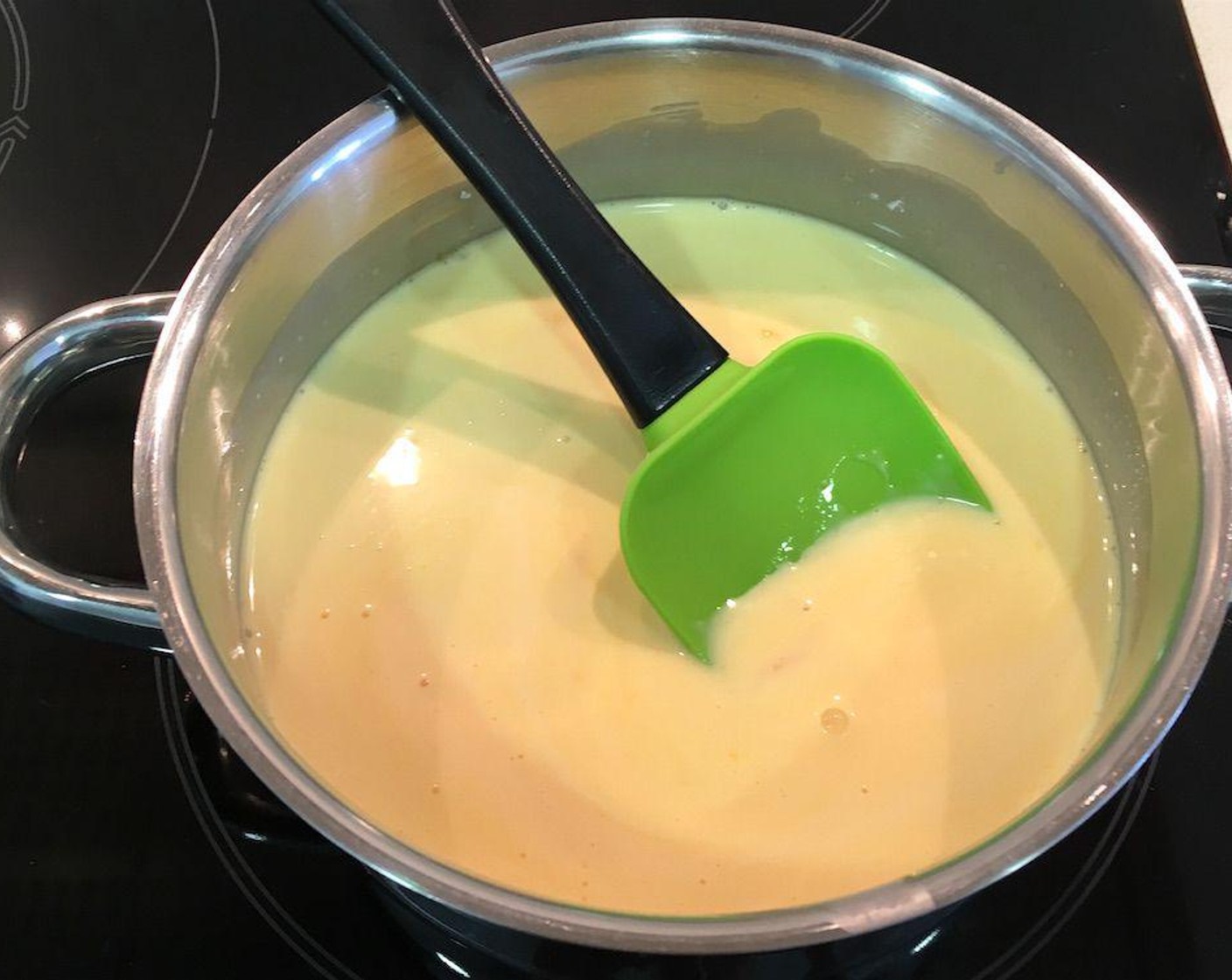 step 6 Combine egg yolks in a small sauce pan with the Granulated Sugar (3/4 cup) and Heavy Cream (1 cup). Cook slowly over low heat while constantly stirring until thick enough to coat the back of the spoon, about 10 to 15 minutes.