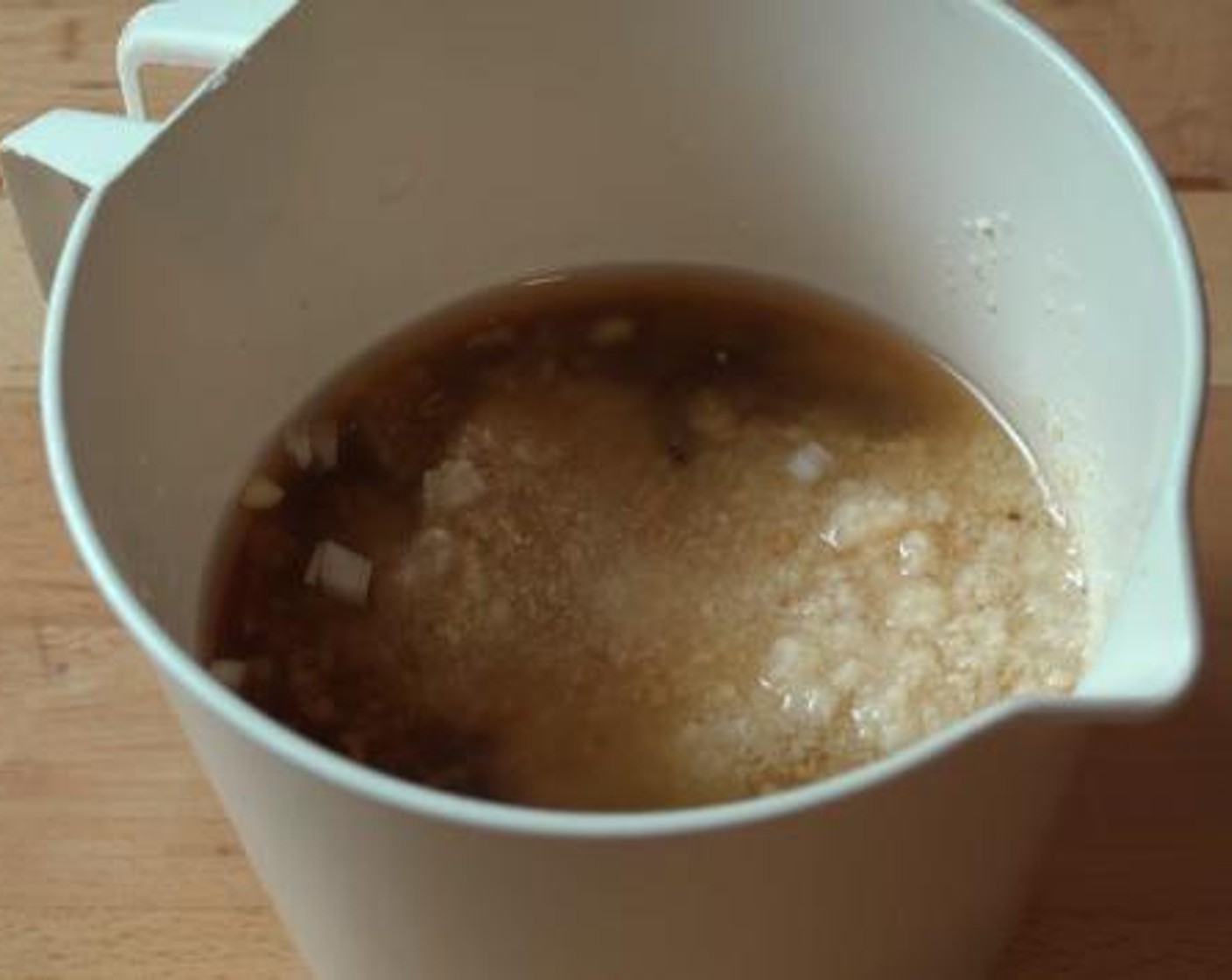 step 1 Inside a mixing bowl, mix together the Onion (1), Light Soy Sauce (1/2 cup), Honey (1/2 cup), Fresh Ginger (2 tsp), Rice Vinegar (4 Tbsp), Garlic (2 cloves), and Freshly Ground Black Pepper (to taste).