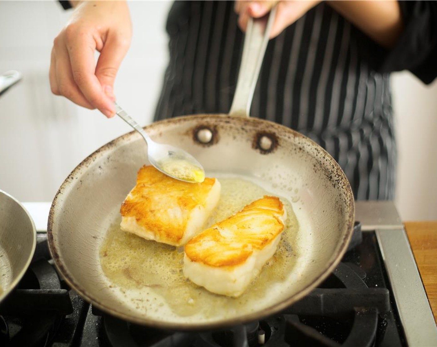 step 20 Add the last tablespoon of Butter (1 Tbsp) and turn fish over. Using a spoon, continuously baste fish with butter and cook for 2 minutes or until cooked and fish begins to flake. Remove from heat.