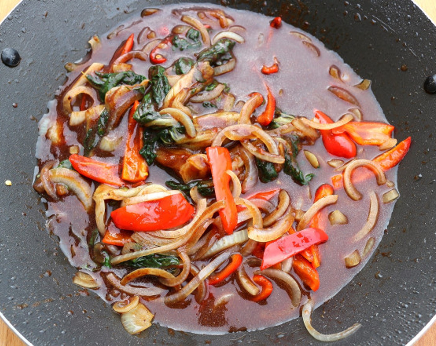 step 8 Add the sauce mix, bring to a simmer, add the baby octopus, simmer for no more that 10 seconds (just to give the rice flour time to thicken but NOT to toughen the octopus), remove from heat. check and adjust the flavor.