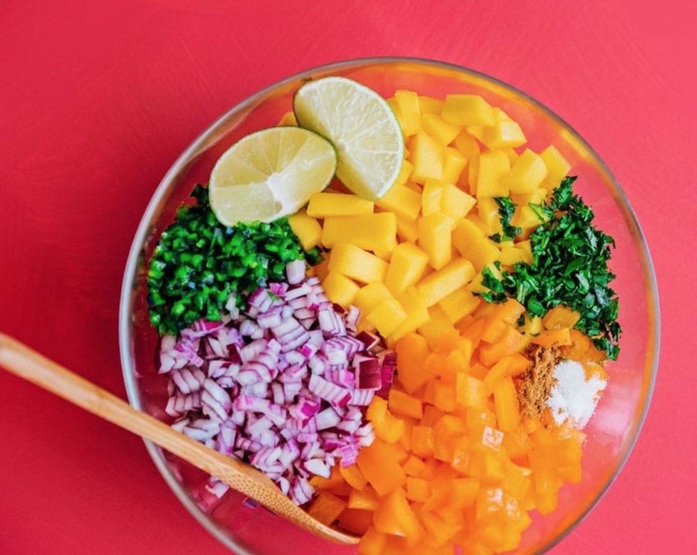 step 1 Combine Mangoes (2), Red Onion (1/2), Bell Pepper (1), Jalapeño Pepper (1), Fresh Cilantro (1/4 cup), juice of a Lime (1), Ground Cumin (1 tsp), and Salt (1/2 tsp) in a large bowl.