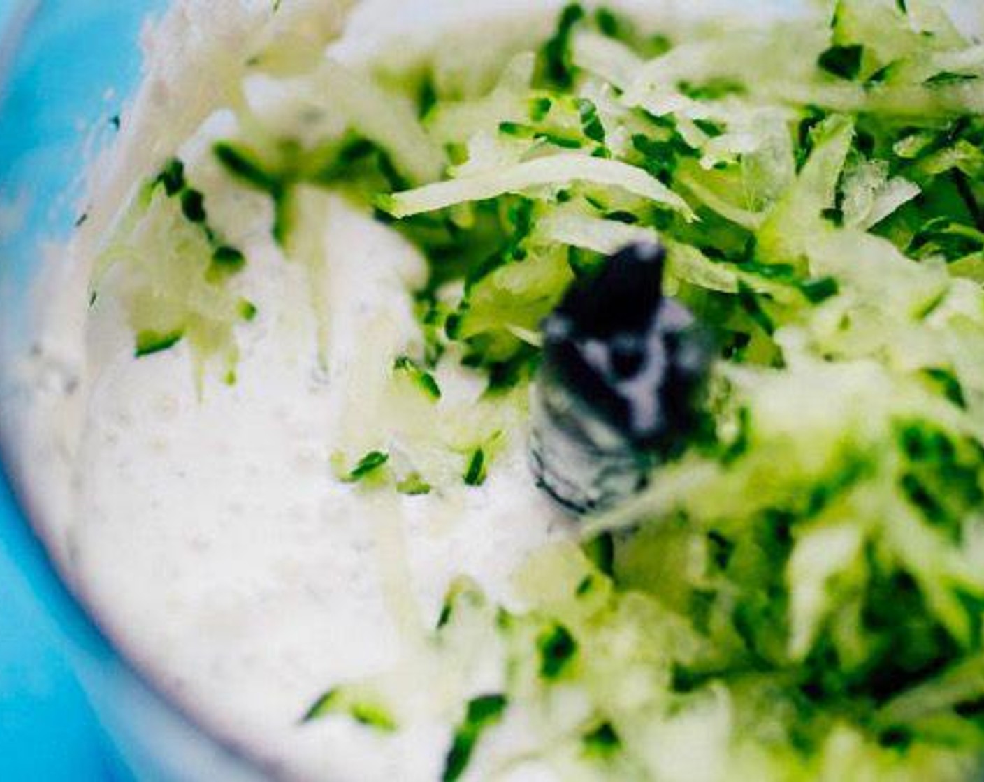 step 2 Set Cucumber (1/2 cup) in a colander or sieve and press out as much water as you can. Stir into the yogurt mixture and season with Salt (1 pinch) and Ground Black Pepper (1 pinch).