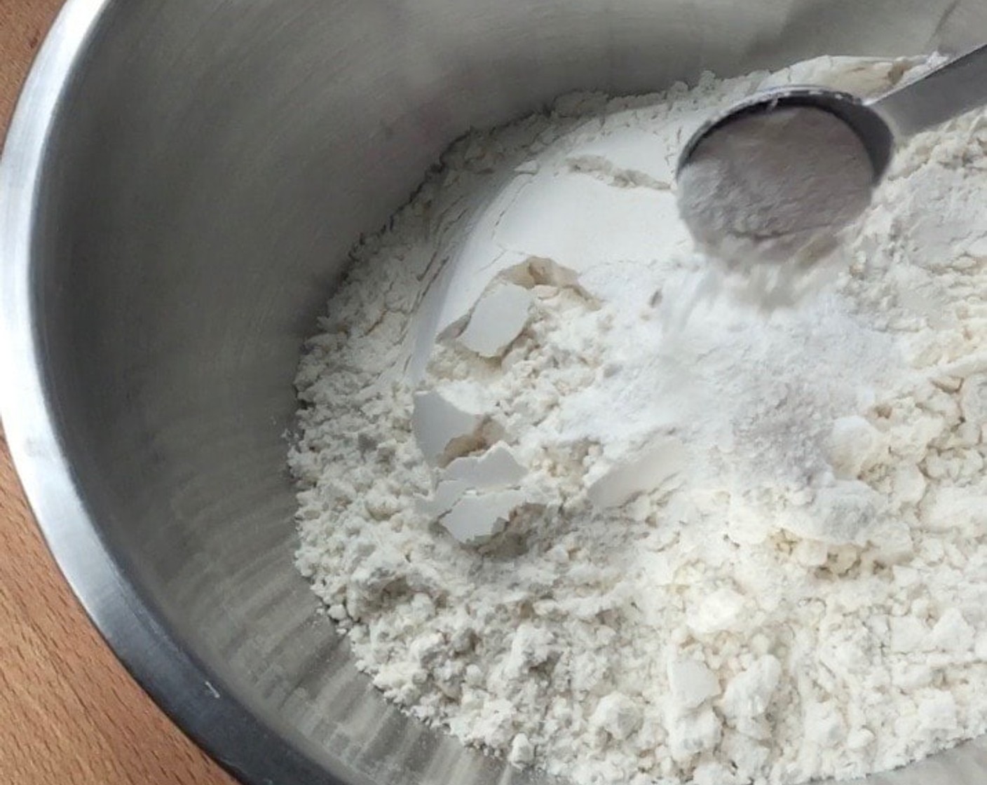 step 9 In a medium size mixing bowl, mix well sifted All-Purpose Flour (2 cups) and Baking Powder (1 Tbsp).