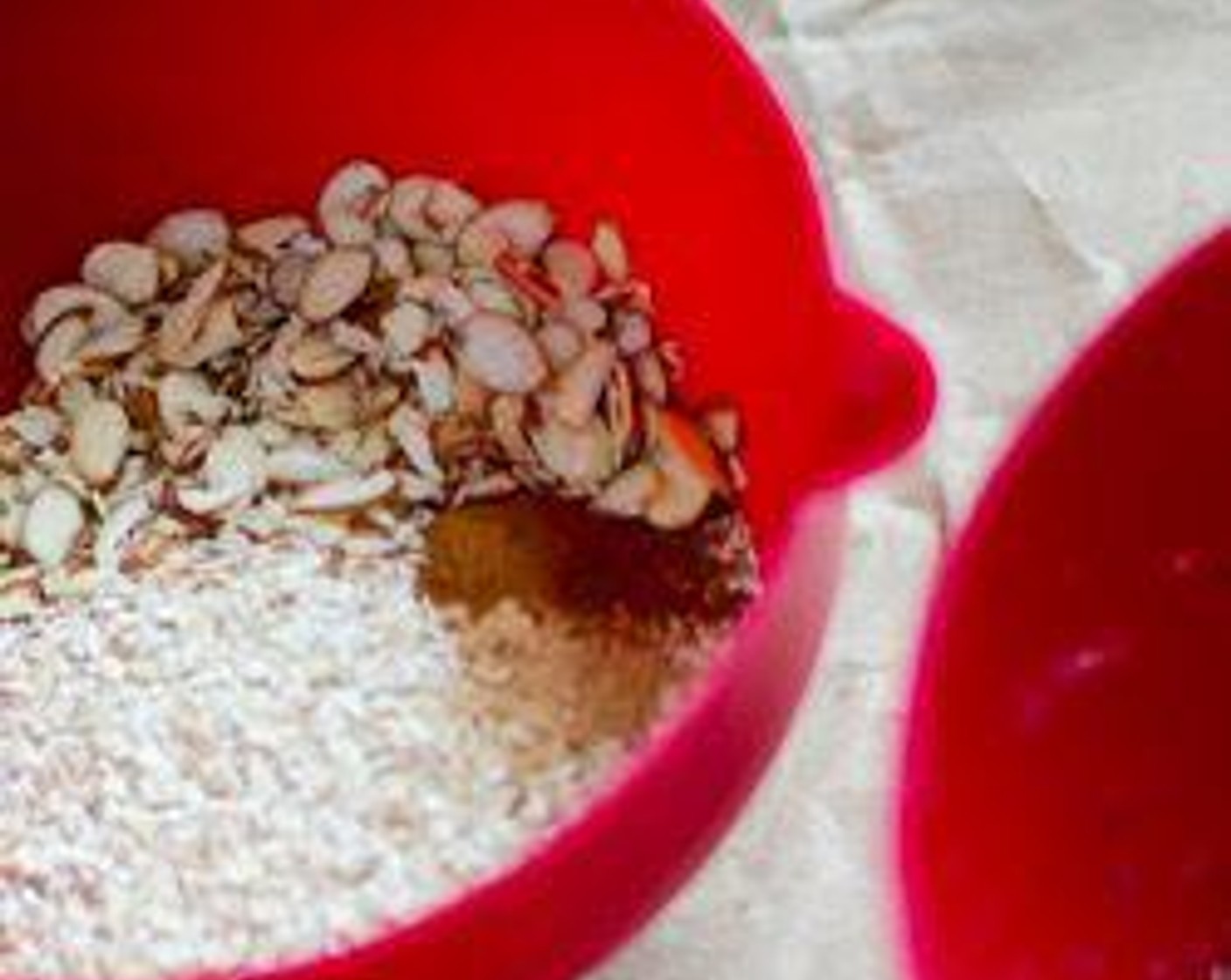 step 2 Mix together the Oats (1 3/4 cups), Slivered Almonds (1/2 cup), Ground Cinnamon (1 tsp), and Ground Ginger (1/2 tsp).
