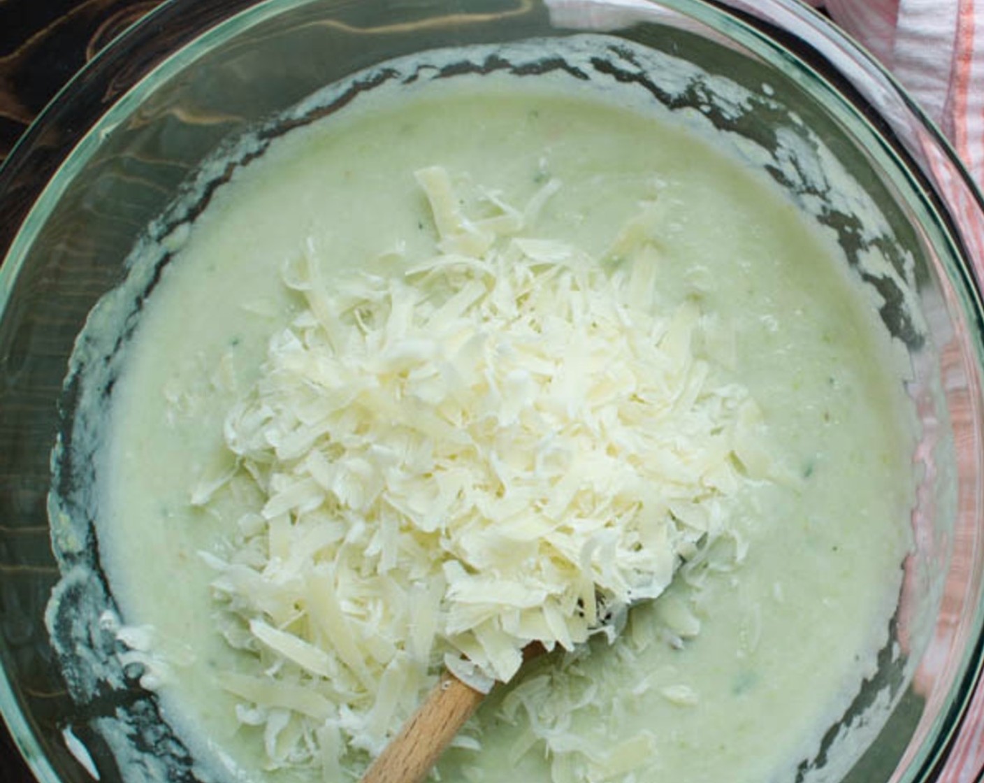 step 8 Stir in the chopped Fresh Thyme (1 tsp) and shredded Gruyère Cheese (1 cup). Add the béchamel sauce to the puree and stir to combine.