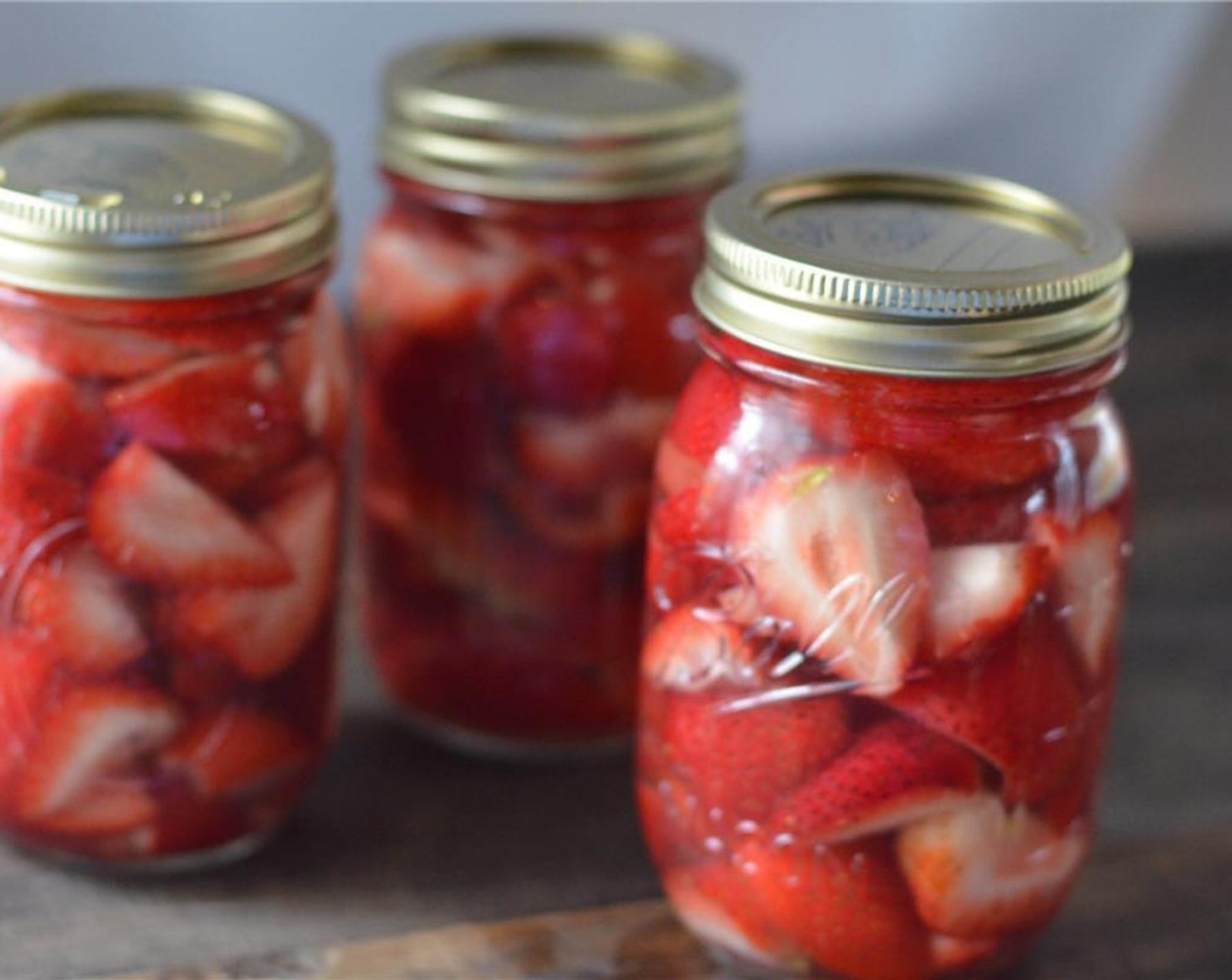 step 3 Fill mason jars with strawberries, packing them in there. Pour GREY GOOSE® Vodka (3 cups) over strawberries, filling to just below the rim.