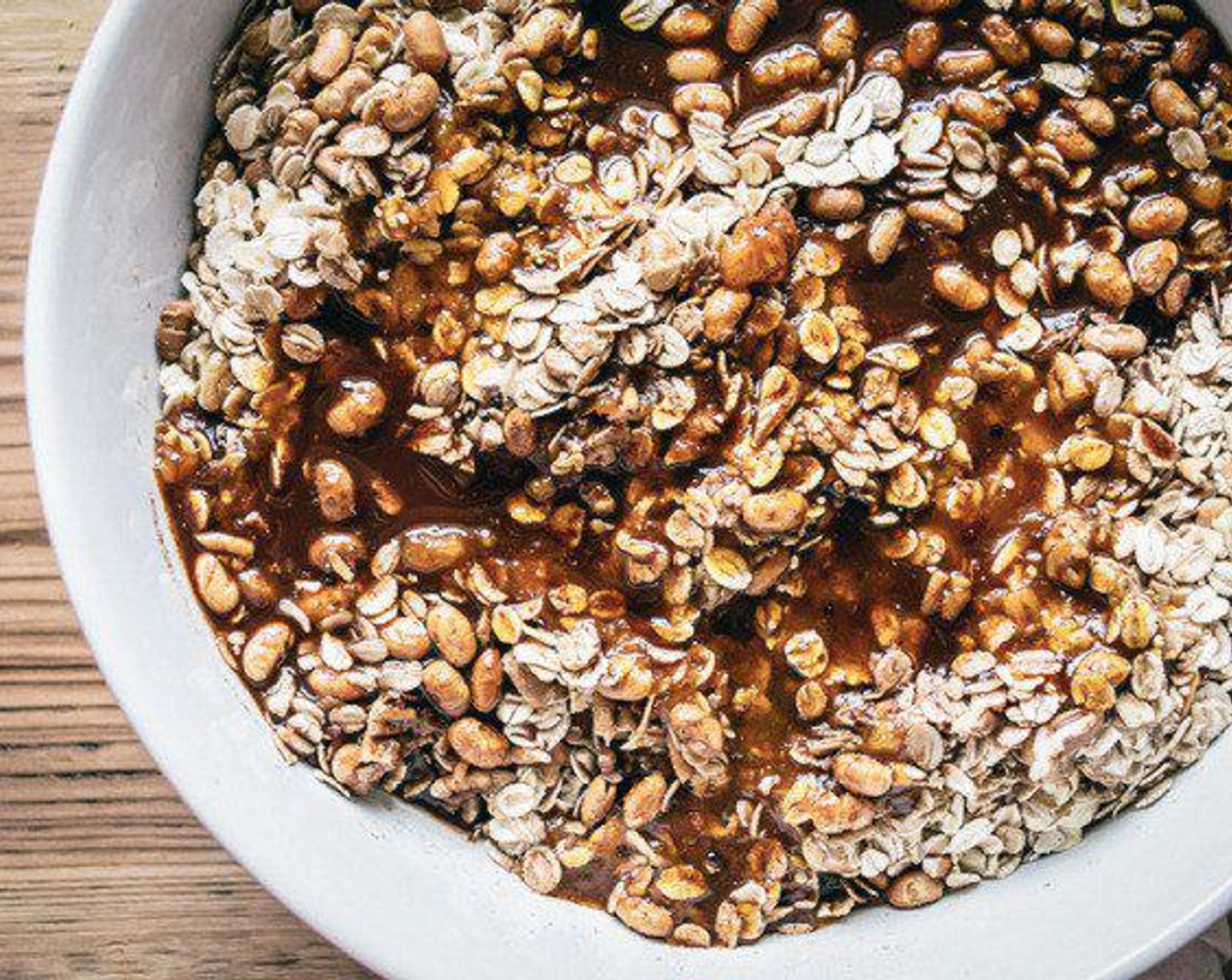 step 5 Pour coconut oil and pumpkin puree mix into large bowl with oat mixture, then stir or mix with hands until oat mixture is completely coated.