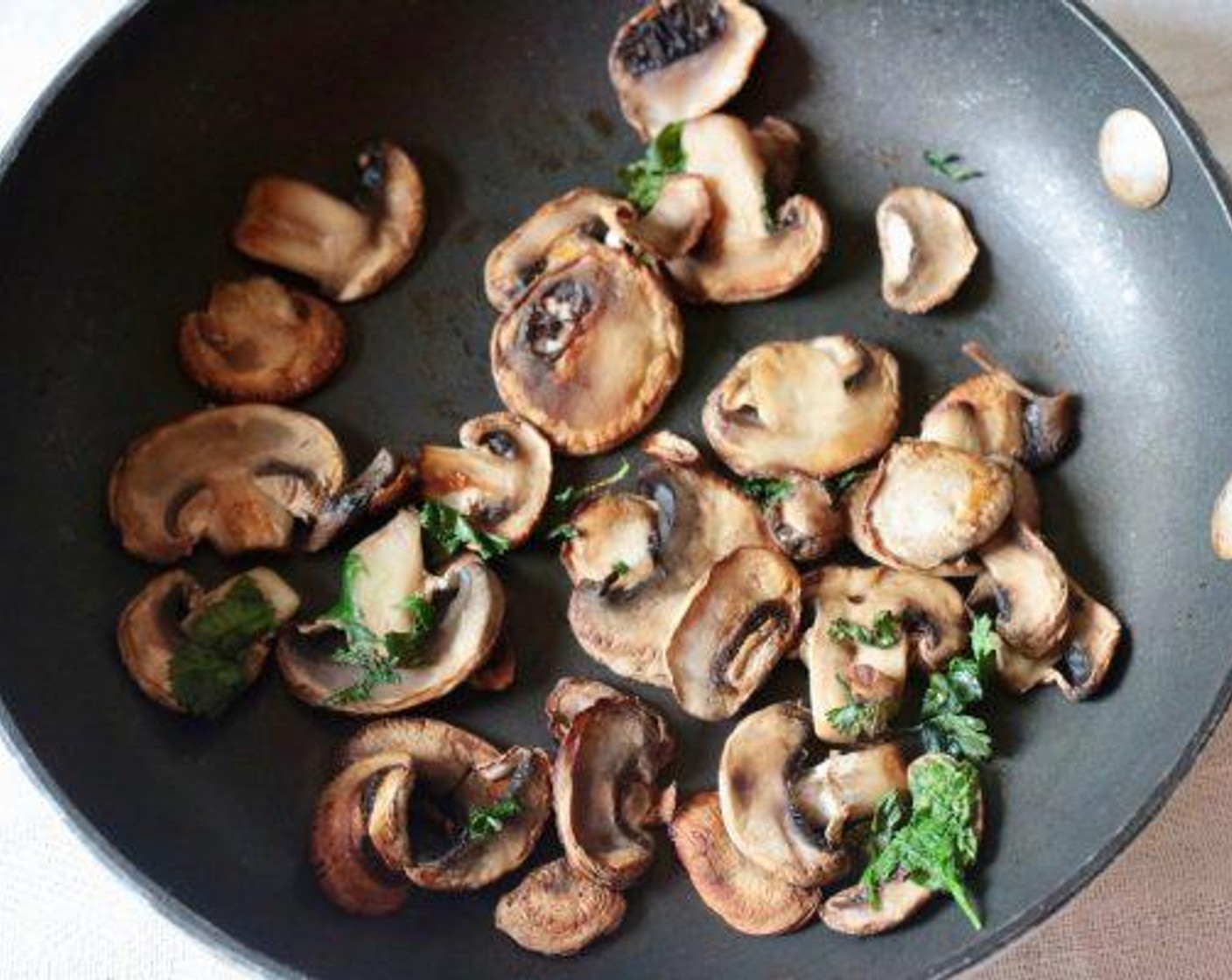 step 6 Add the Fresh Cilantro (1 cup) and cook for another minute, until the mushrooms are lightly browned.