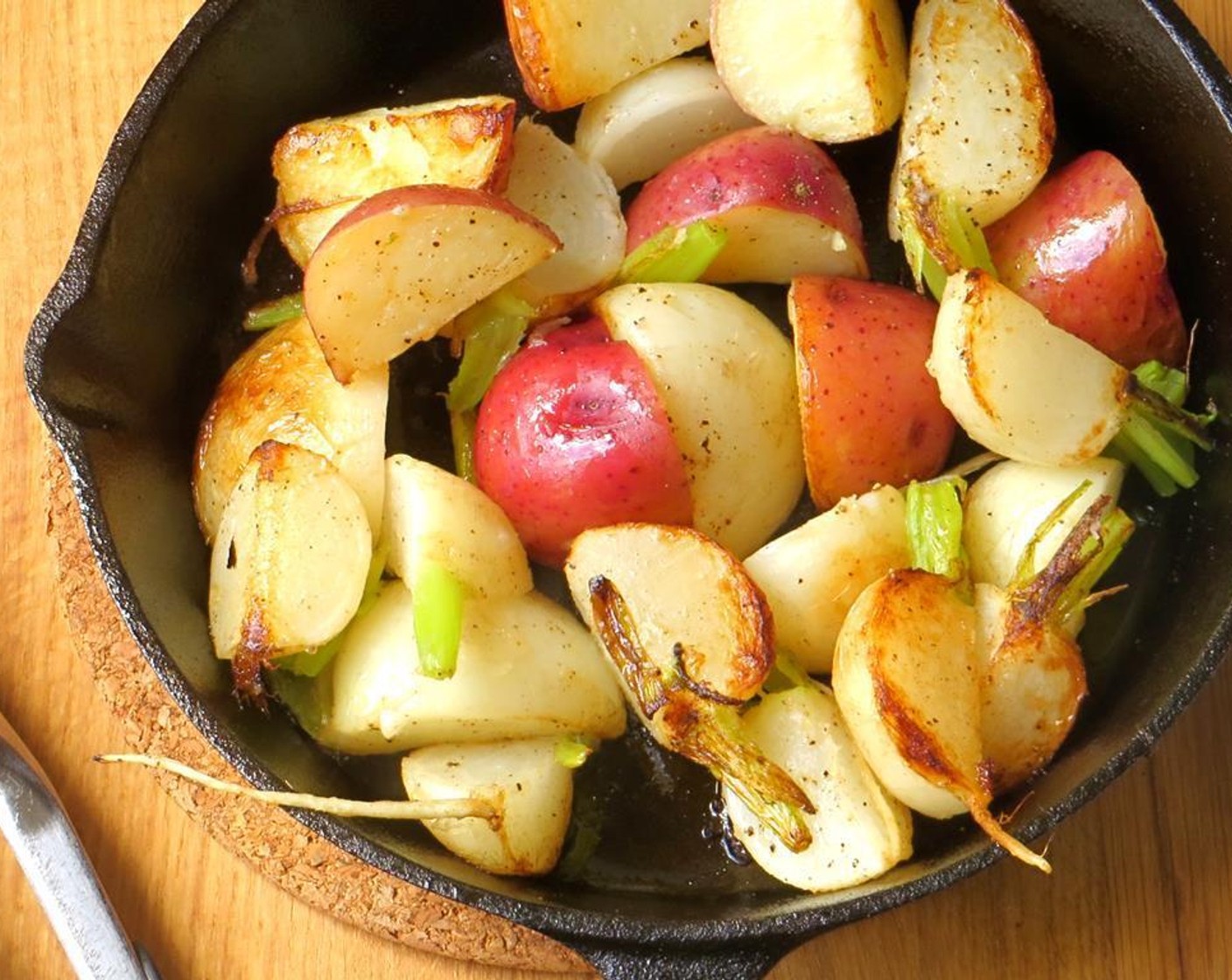 step 6 In a medium skillet or cast iron pan, heat 1/2 teaspoon of the Butter (1 tsp) and 2 teaspoons of the Olive Oil (1 Tbsp) over medium to medium-high heat. Add sliced turnips and potatoes. Sauté vegetables until crispy and browned. Transfer to a bowl.