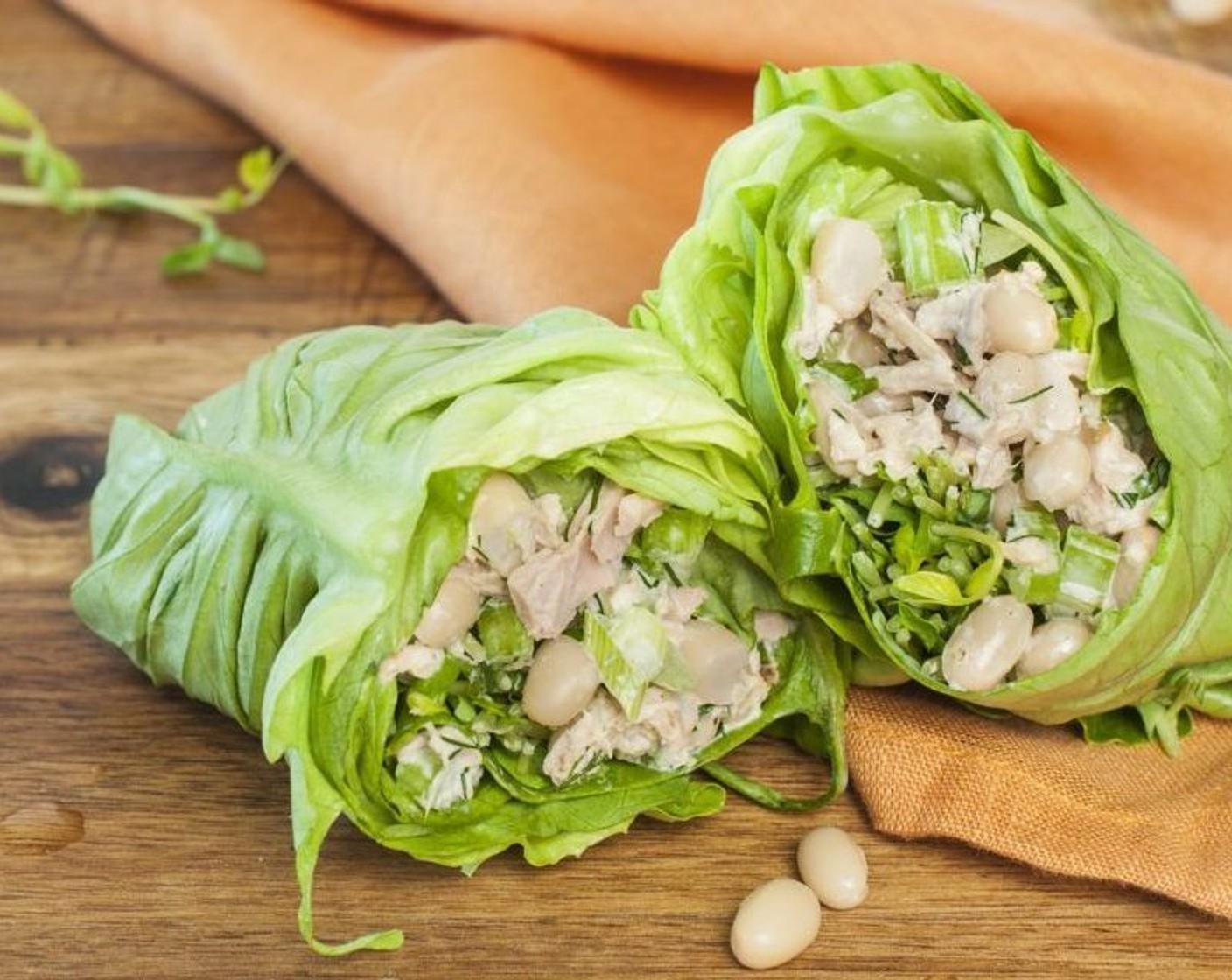 step 5 Wrap lettuce around the salad, tucking in the ends as you roll, much like a cabbage roll. Cut in half and serve immediately.