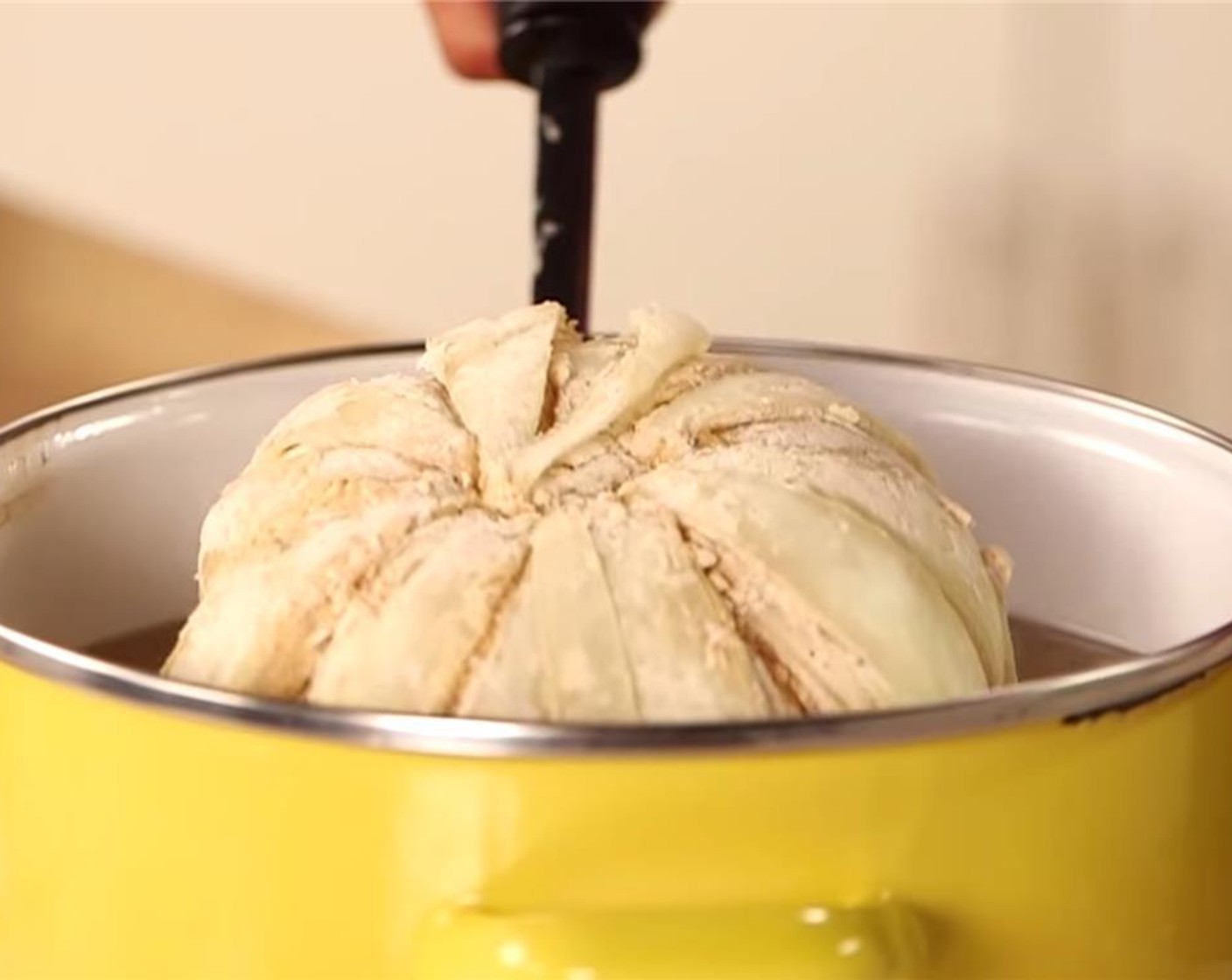 step 8 In the deep-fryer or Dutch oven, add the onion cut-side down in the oil for 2-3 minutes, then carefully flip the onion and allow it to fry for an additional 2-3 minutes or until the batter is golden brown.