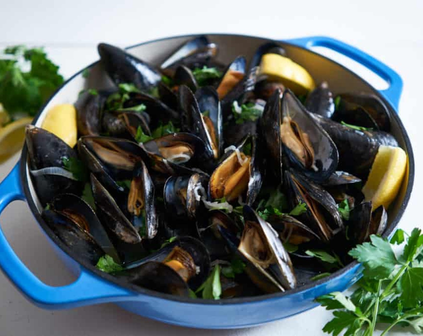 step 7 Remove lid, add Butter (2 Tbsp), swirl, and stir. Remove any mussels that have not opened. Do not eat a mussel that didn't open! Transfer mussels to serving bowls, spoon sauce over them, top with Italian Flat-Leaf Parsley (to taste). Serve with crusty bread.