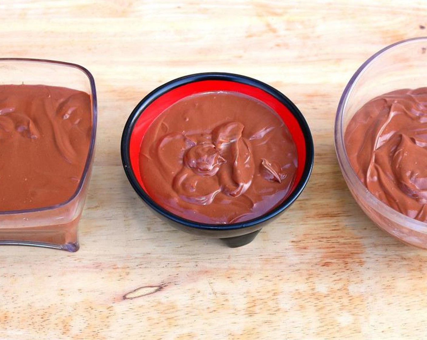 step 5 Spoon the mousse into four small or three slightly larger serving cups and chill until firm, covered with plastic wrap.