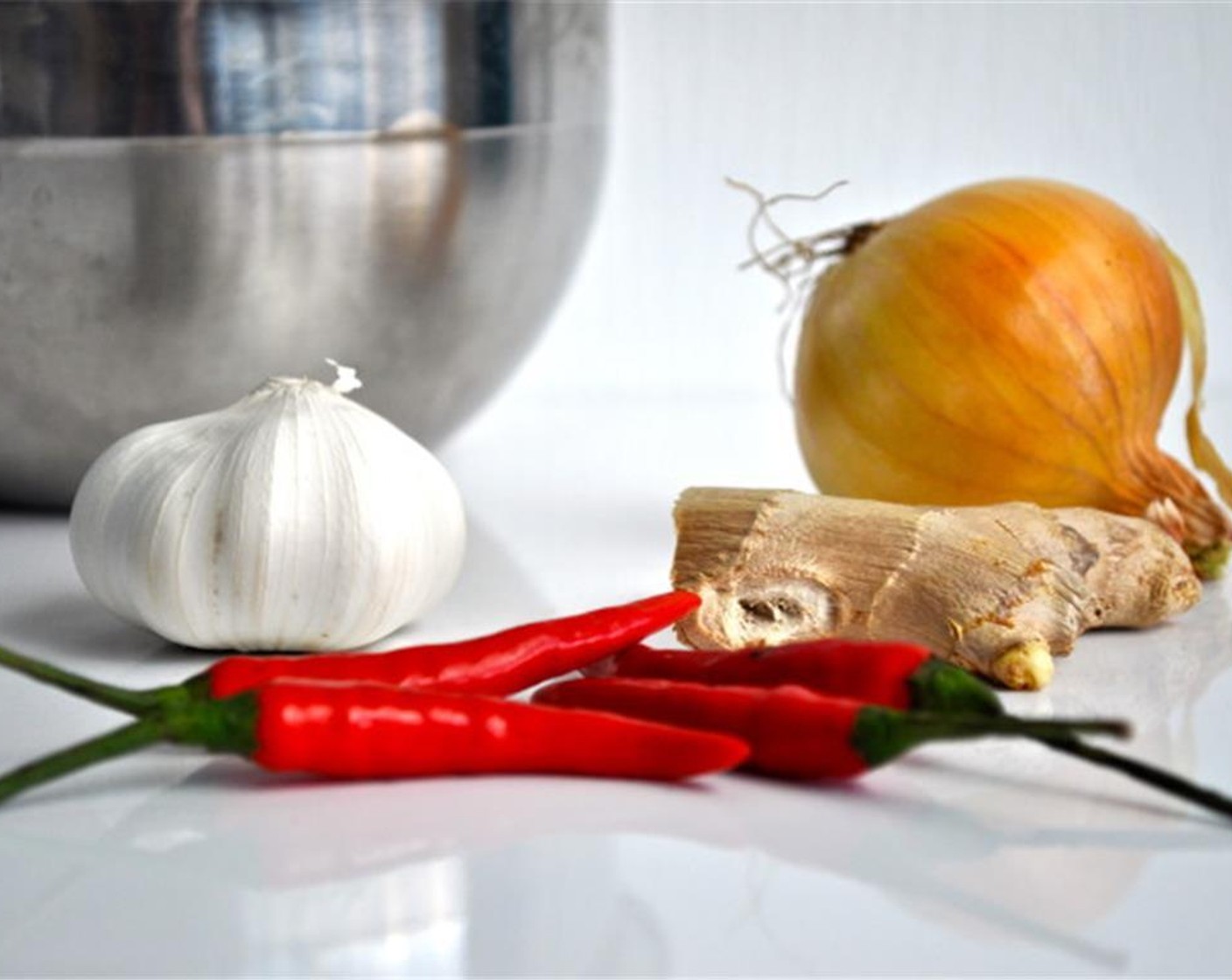 step 8 In the same pan, melt Butter (3 Tbsp) on low heat and saute your onion, garlic, chili and ginger on low-medium heat for 10-15 minutes, stirring occasionally. By the end everything in the pan will be fragrant and golden brown, but not burnt.