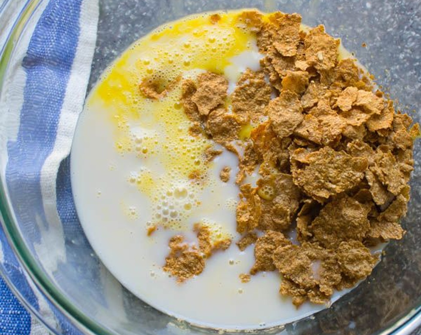 step 3 In a large bowl, lightly beat the Eggland's Best Classic Eggs (2). Stir in Raisin Bran Cereal (1 1/2 cups), Almond Milk (1 1/2 cups), Vegetable Oil (4 Tbsp) and Vanilla Extract (1 tsp). Let stand 10 minutes; then stir to break up cereal.