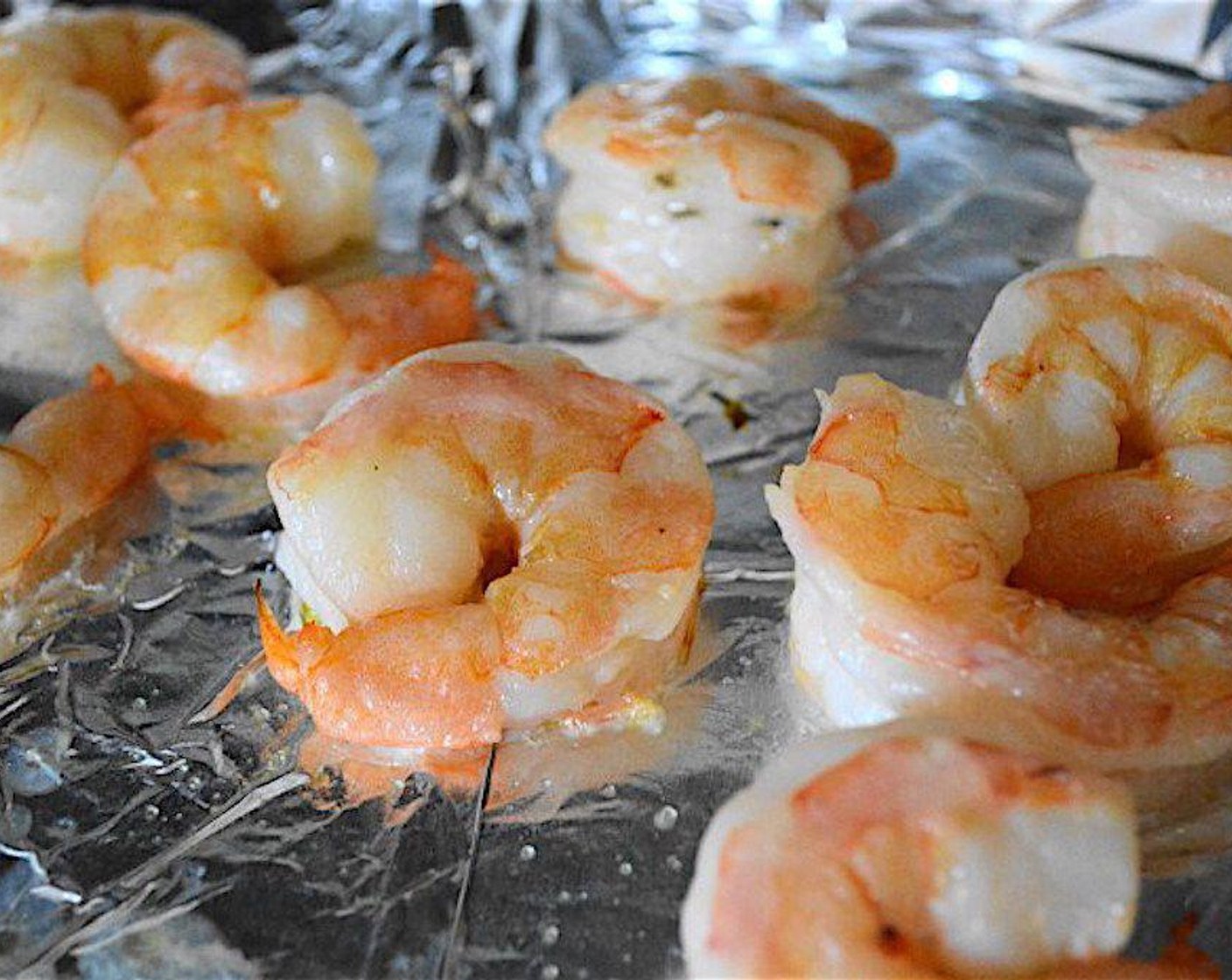 step 2 Lay Shrimp (1 lb) out on the sheet and toss them well with a generous sprinkle of Salt (to taste) and an equally generous drizzle of Olive Oil (as needed).