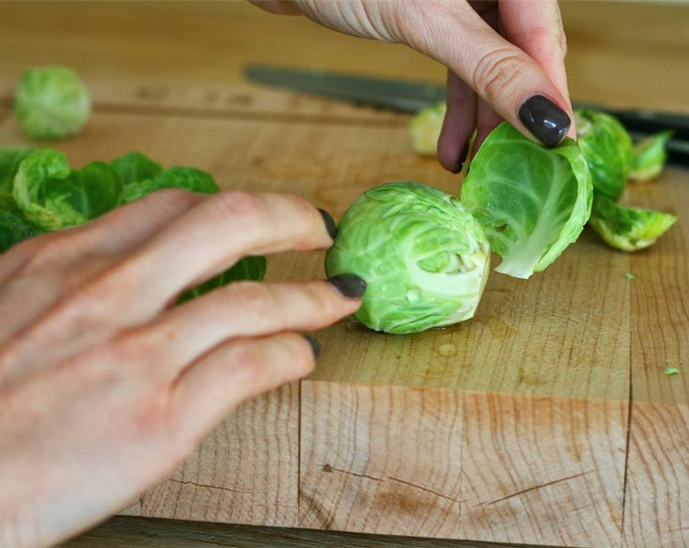 step 2 Trim off the end of each of the Brussels Sprouts (20). The leaves will either fall off or easily peel off. When you get to the point where they no longer will peel off, trim the end again and repeat the process.