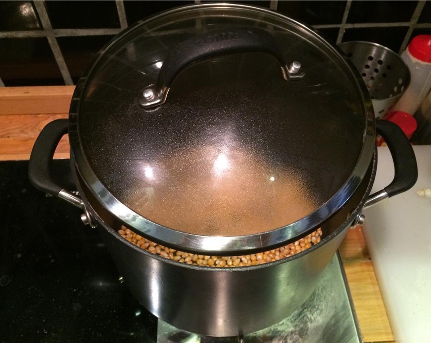 step 6 Return the pot to the stove. Set the lid so there is a small gap, which will allow steam to escape so your popcorn doesn't get soggy.