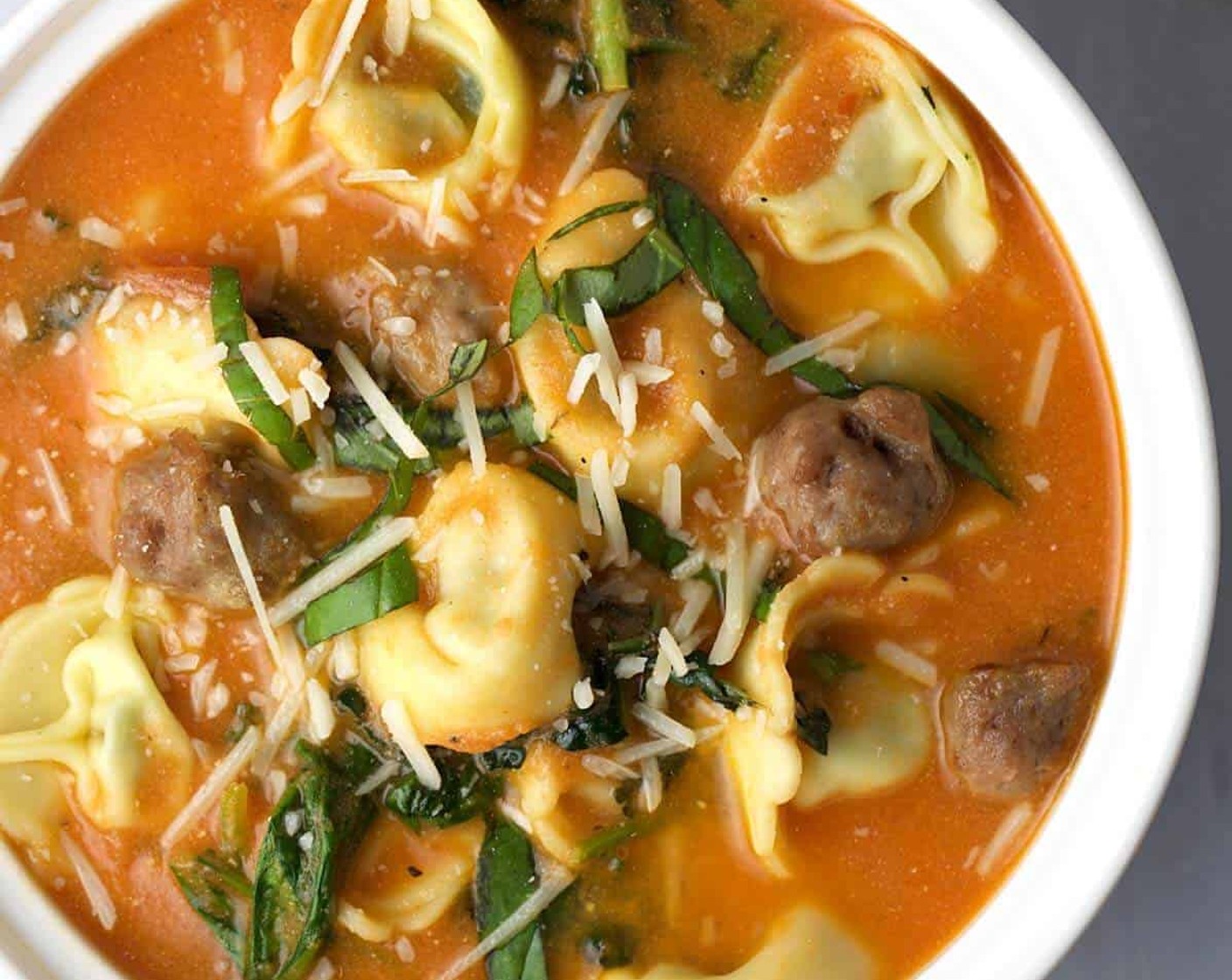 Tuscan Tomato Tortellini Soup with Italian Sausage and Greens