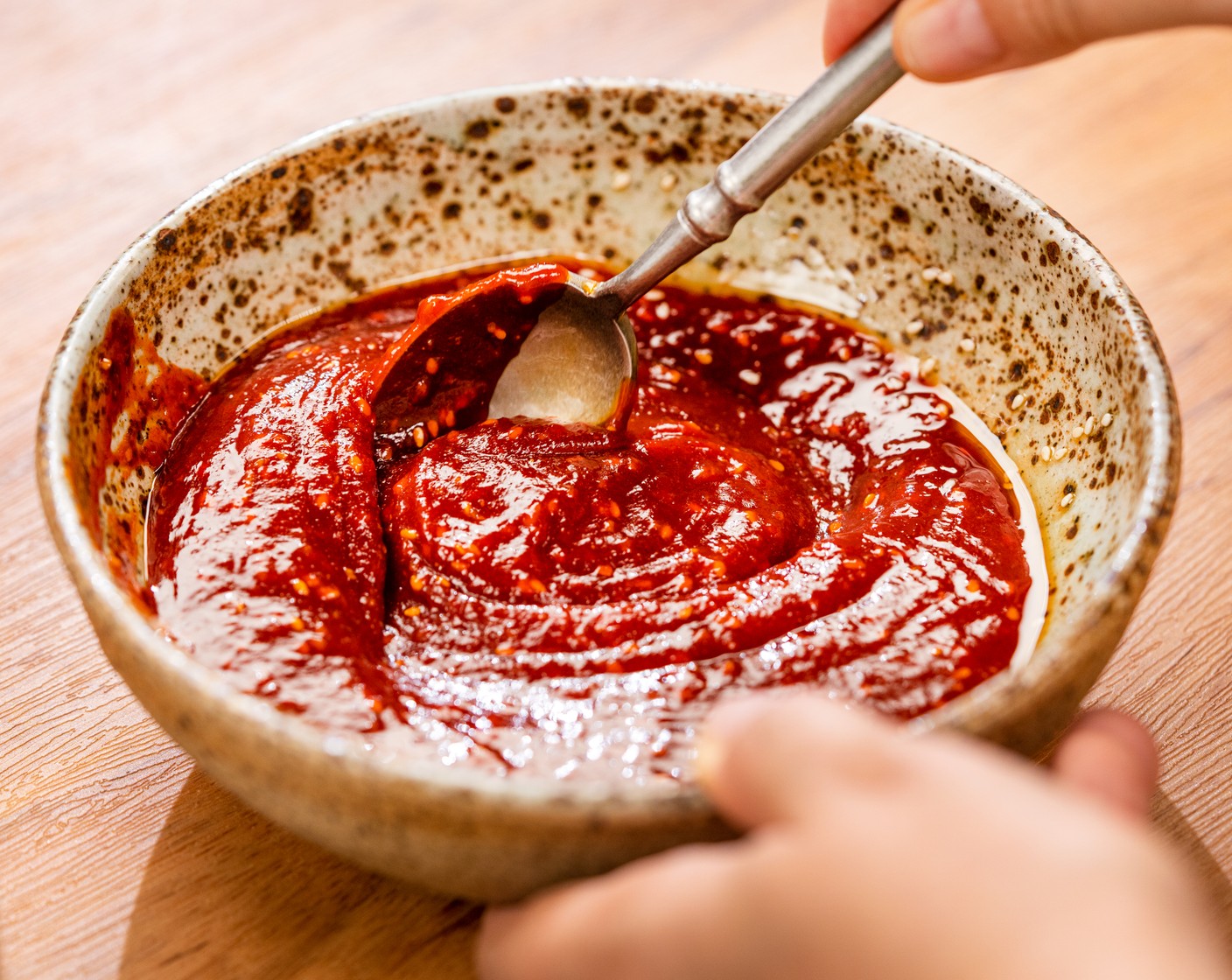 step 2 Make the sauce. In a small bowl, combine Gochujang (1/2 cup), Honey (3 Tbsp), Sesame Oil (3 Tbsp), Soy Sauce (1 Tbsp), Garlic (2 cloves), Rice Vinegar (1 tsp), and Toasted White Sesame Seeds (1 tsp). Slowly add small splashes of Water (1 Tbsp) until it’s a thin, runny consistency (to help coat the chicken), I used 2 Tbsp of water total. Set aside.