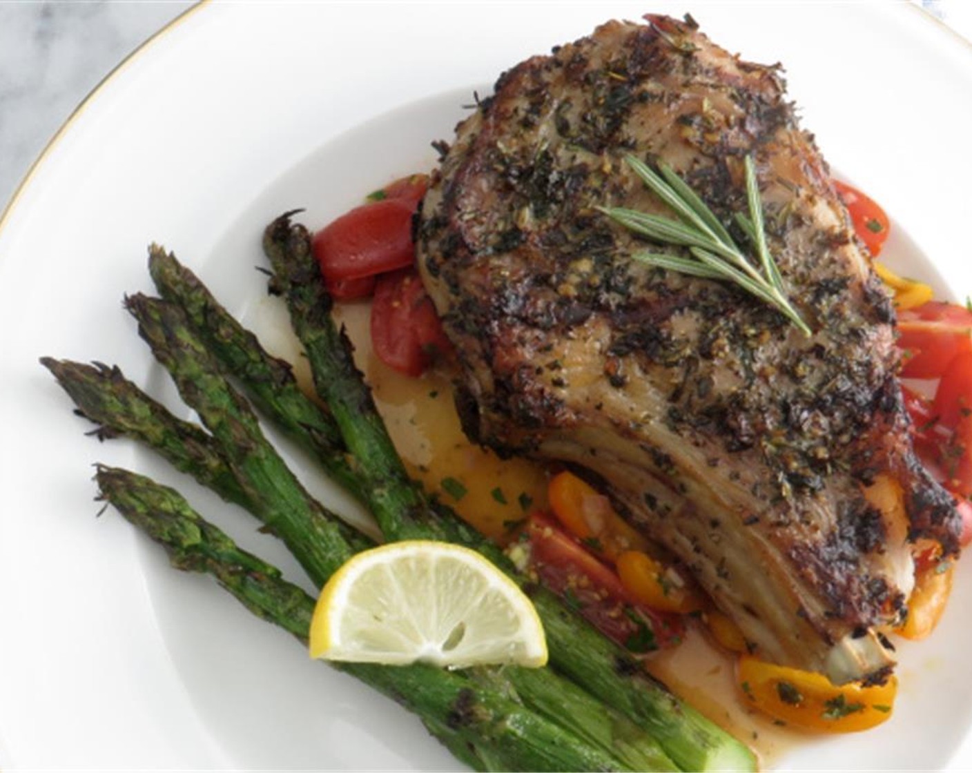 step 9 Transfer chops to a platter and let rest for 5 minutes. To serve, spoon tomato vinaigrette onto each plate and top with a veal chop. Enjoy!