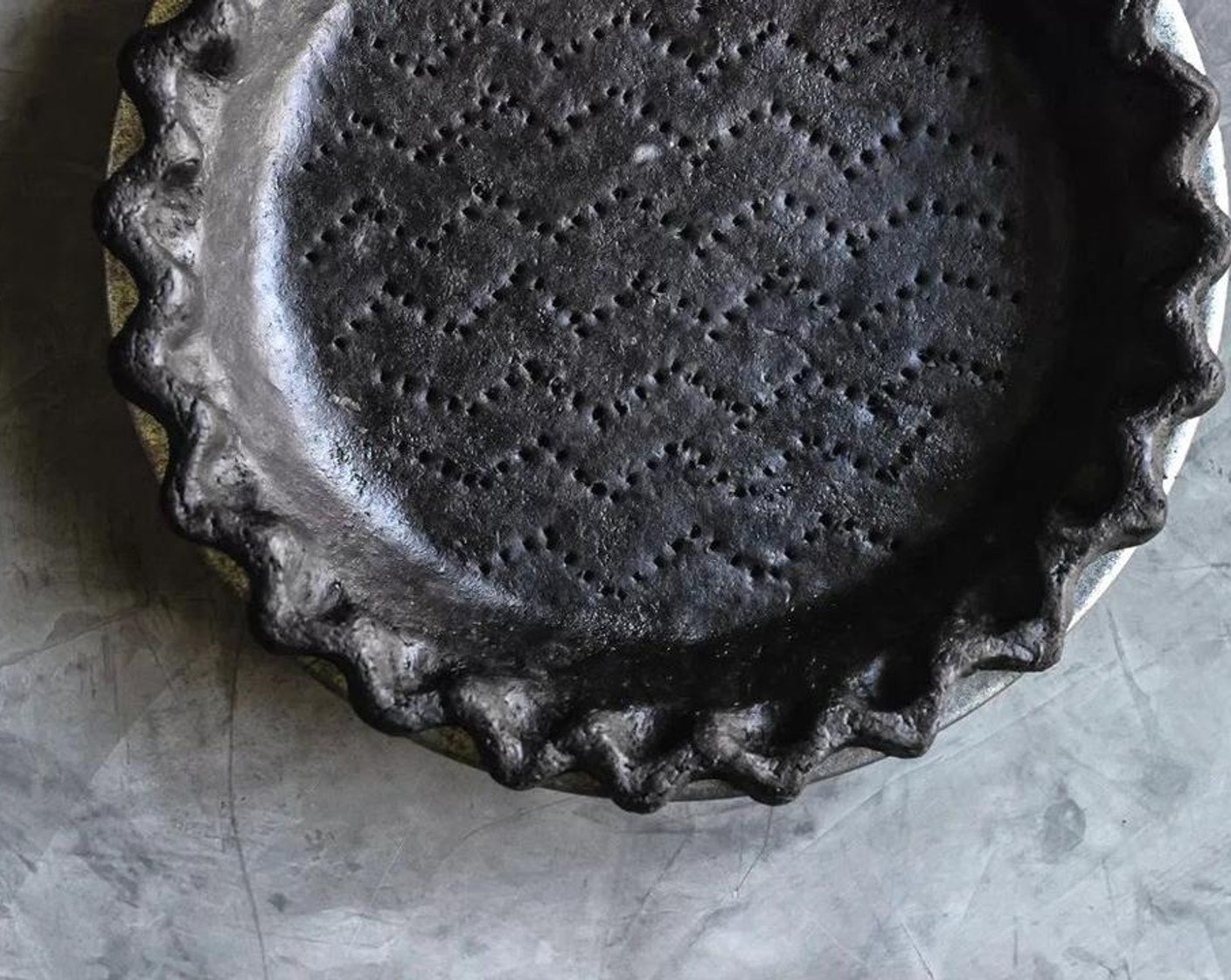 step 4 Line the refrigerated pie crust with a circle of parchment paper and pie weights or dried beans and bake for 15 minutes, remove pie crust from oven, remove parchment and weights and beans, return to the oven to bake for another five minutes. Remove pie crust from oven and let crust cool at room temperature