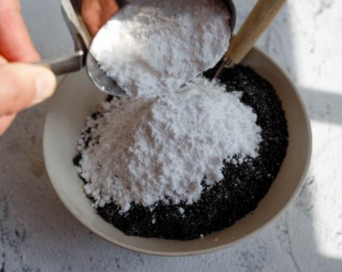 step 2 In a bowl, mix black sesame powder with Salt (1/4 tsp) and Powdered Confectioners Sugar (1 cup).