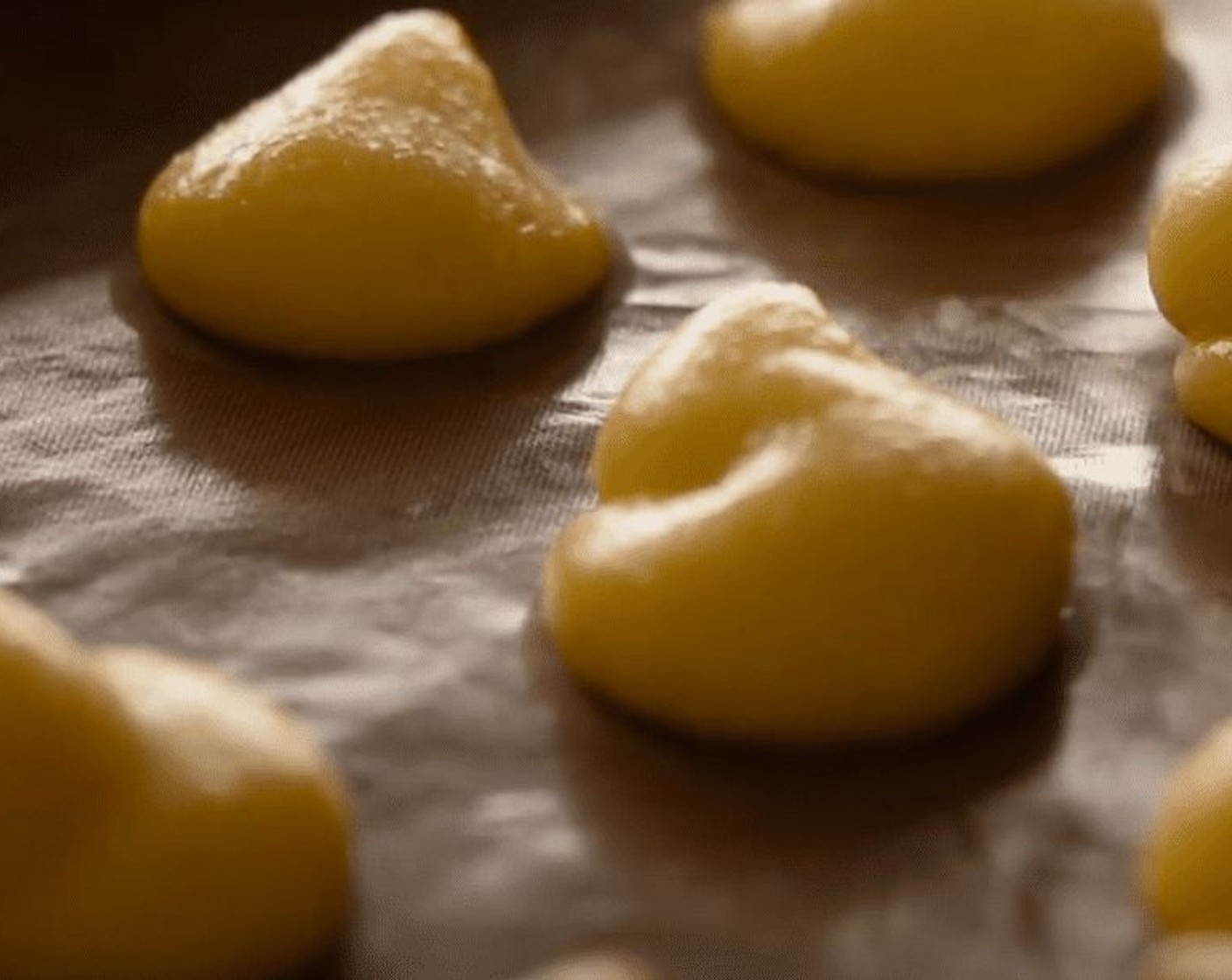 step 18 To make the choux buns, place teaspoons of the mixture on the baking tray, leaving about 2.5 cm between them.