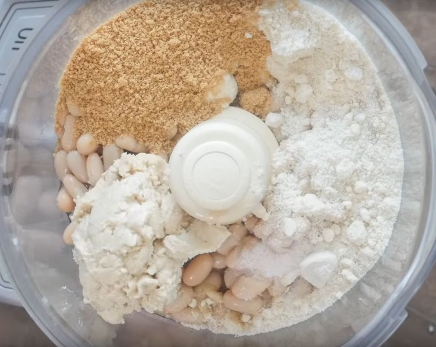 step 1 To a food processor add White Beans (1 can), Cashew Butter (1/2 cup), Almond Flour (3/4 cup), Maple Syrup (1/4 cup), Vanilla Extract (1 Tbsp), and Sea Salt (1/2 tsp).