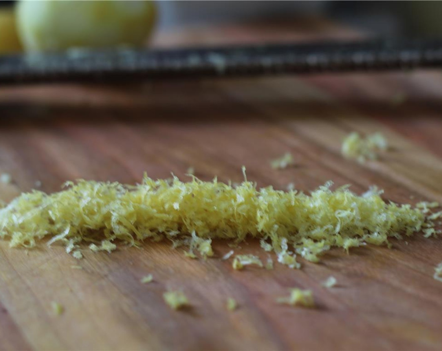 step 1 Using a microplane, grate the peeled Garlic (1 clove) into a bowl. Zest the Lemon (1) into the same bowl, and then juice the lemon into the bowl.