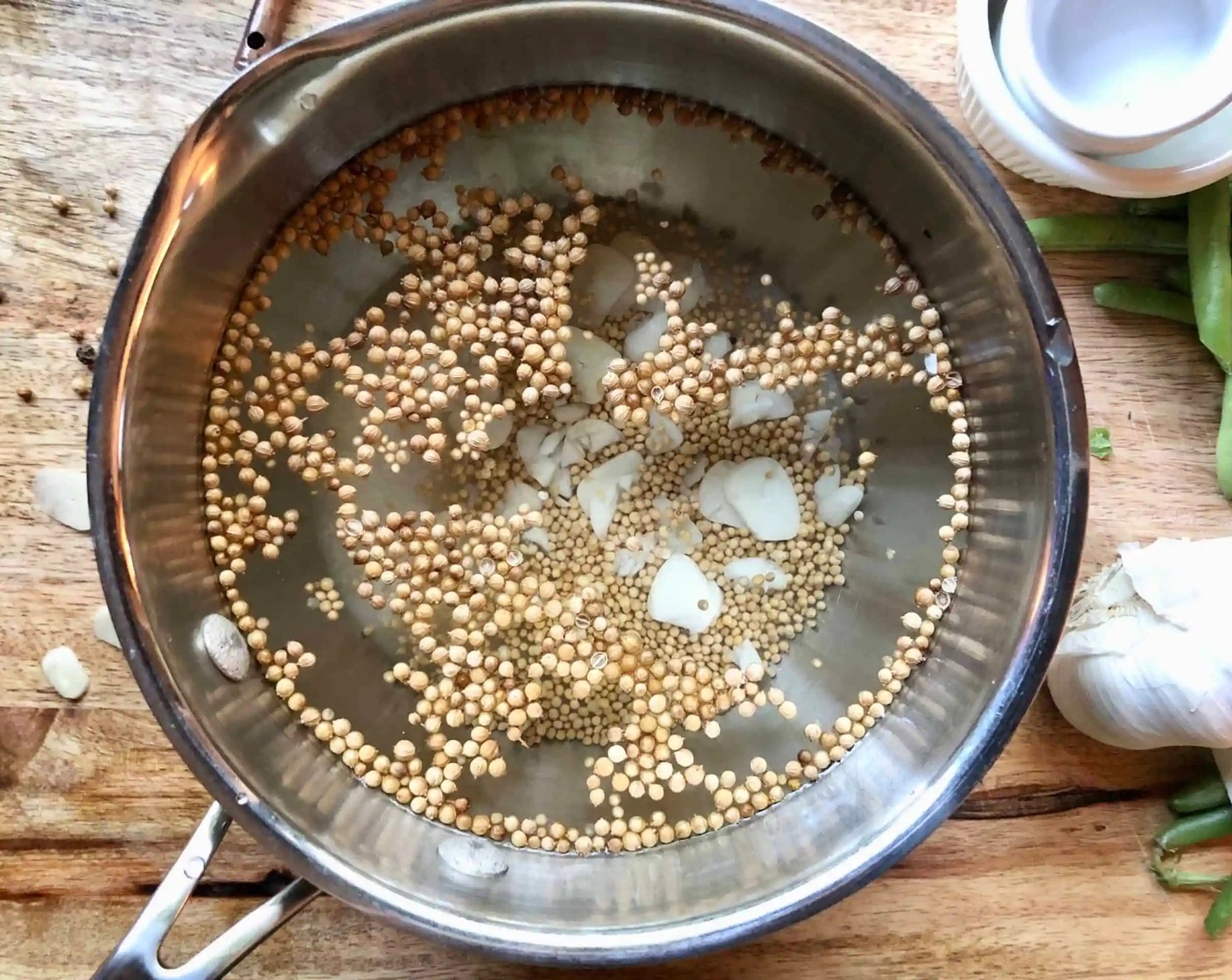 step 1 In a small pot, combine the Distilled White Vinegar (1 1/2 cups), Water (1 cup), Kosher Salt (2 Tbsp), Granulated Sugar (2 Tbsp), Mustard Seeds (1 Tbsp), aWhole Coriander Seeds (1 Tbsp), and Garlic (1 clove). Bring to a boil.